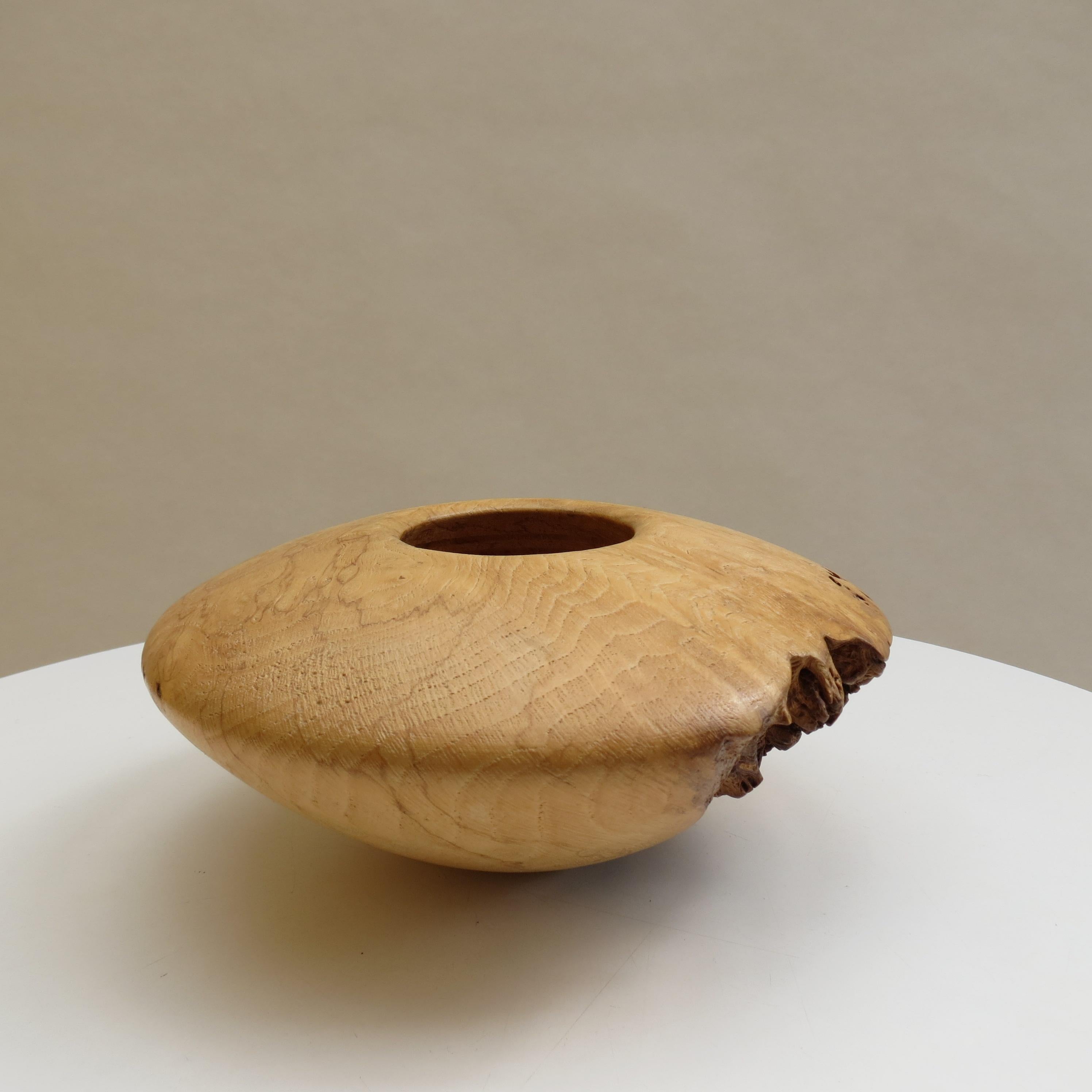 A very elegant vintage wooden sculptural pot or bowl made from burr oak, with some contrasting areas of natural burr. Wonderful shape with small circular opening to the top, hand-turned rings to the interior of the pot. Hand produced by Mike Scott