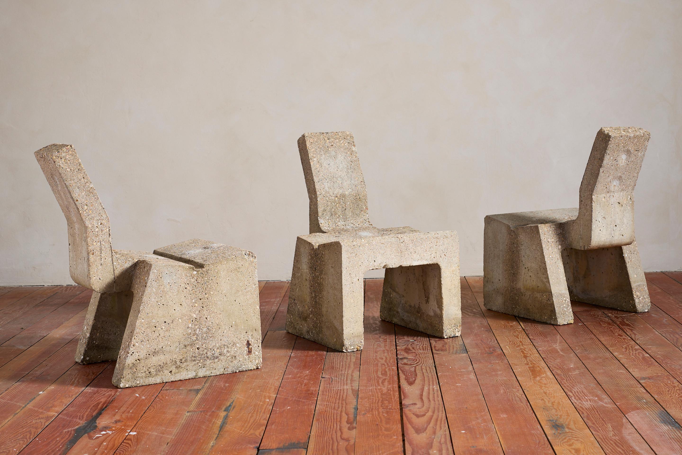 Unique solid concrete sculptural chairs with geometric angular shape
France, 1950's 
Extremely heavy and solid construction 
Interesting from every angle. 

Priced individually 