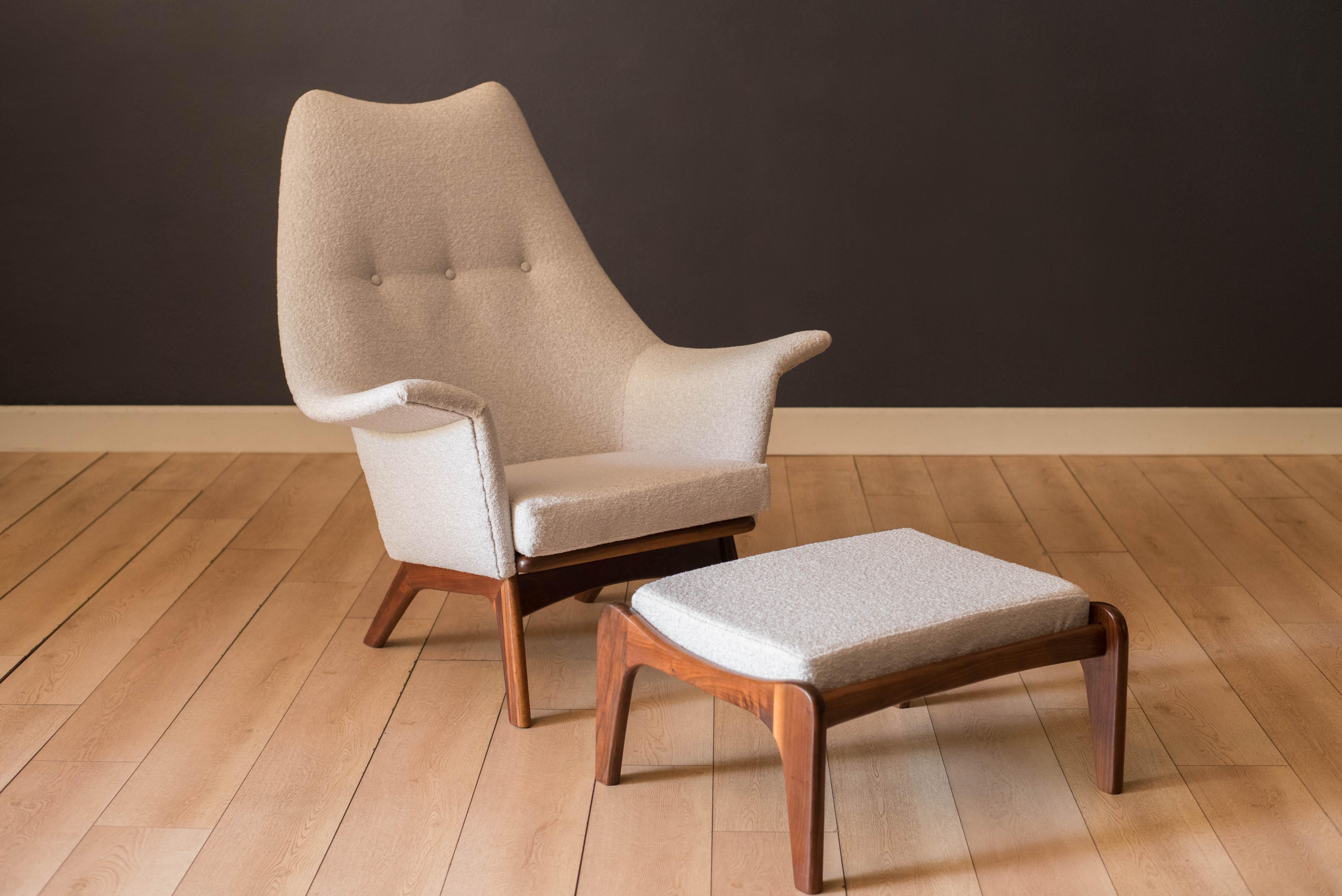 Mid century modern 1611-C wingback lounge chair and ottoman model no. 1211-O designed by Adrian Pearsall for Craft Associates. This set features sculptural solid walnut frames and has been newly reupholstered in a light grey and white nubby boucle