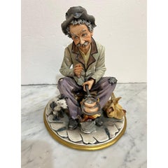 Vintage Sculpture Hand Painted"Man frying sausage on Camp Fire "