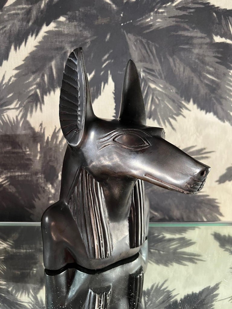 Vintage sculpture of Anubis, the Egyptian jackal-headed deity who presided over the embalming process and accompanied dead kings in the afterworld. Hand crafted and comprised of heavy-weighted black resin marble with a polished finish. Can be used