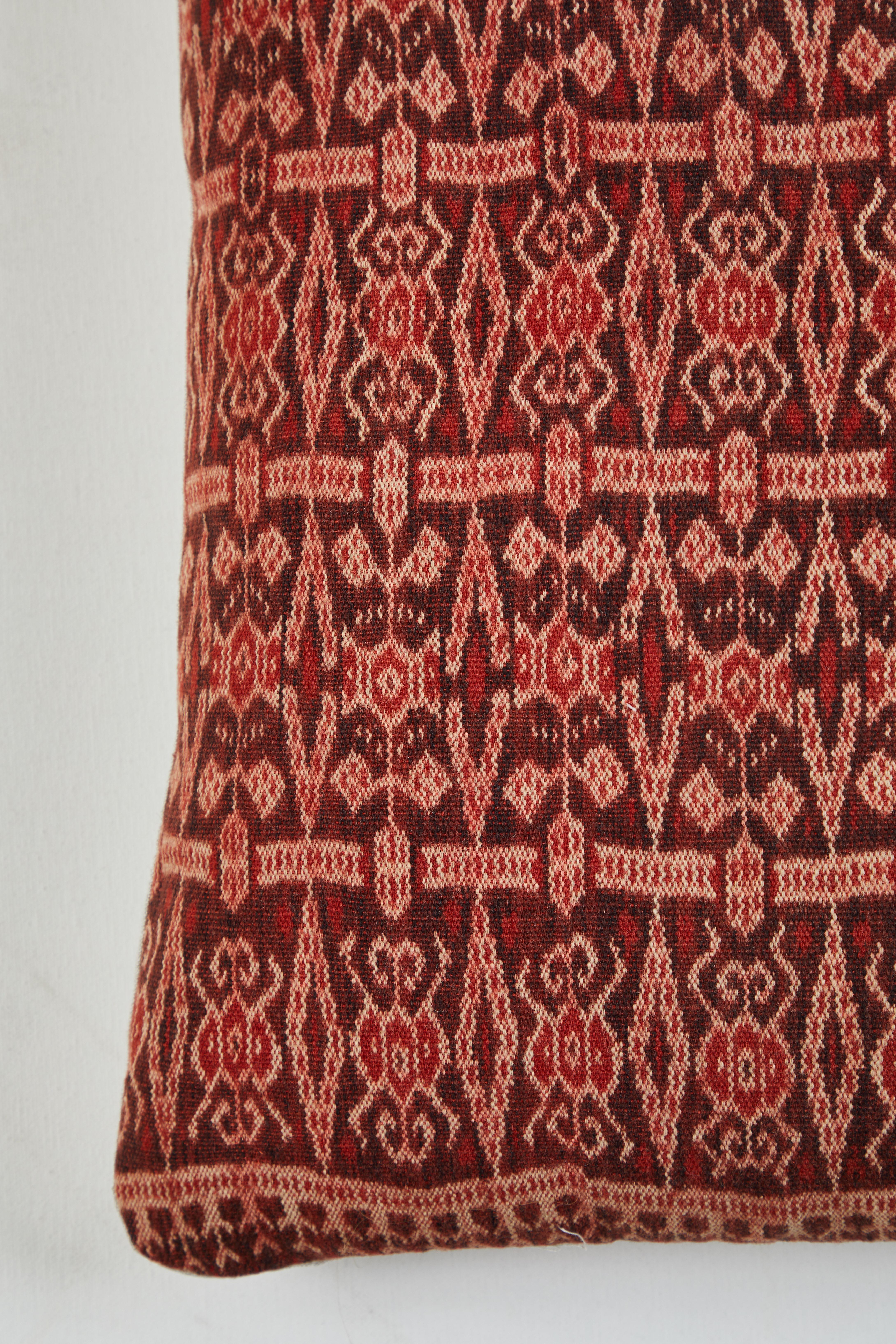 Pat McGann Workshop
Midcentury Southeast Asian handwoven ikat textile. Red, turquoise, gold, purple and pale pink. Natural linen backs. Invisible zippers. Feather and down fill.

 