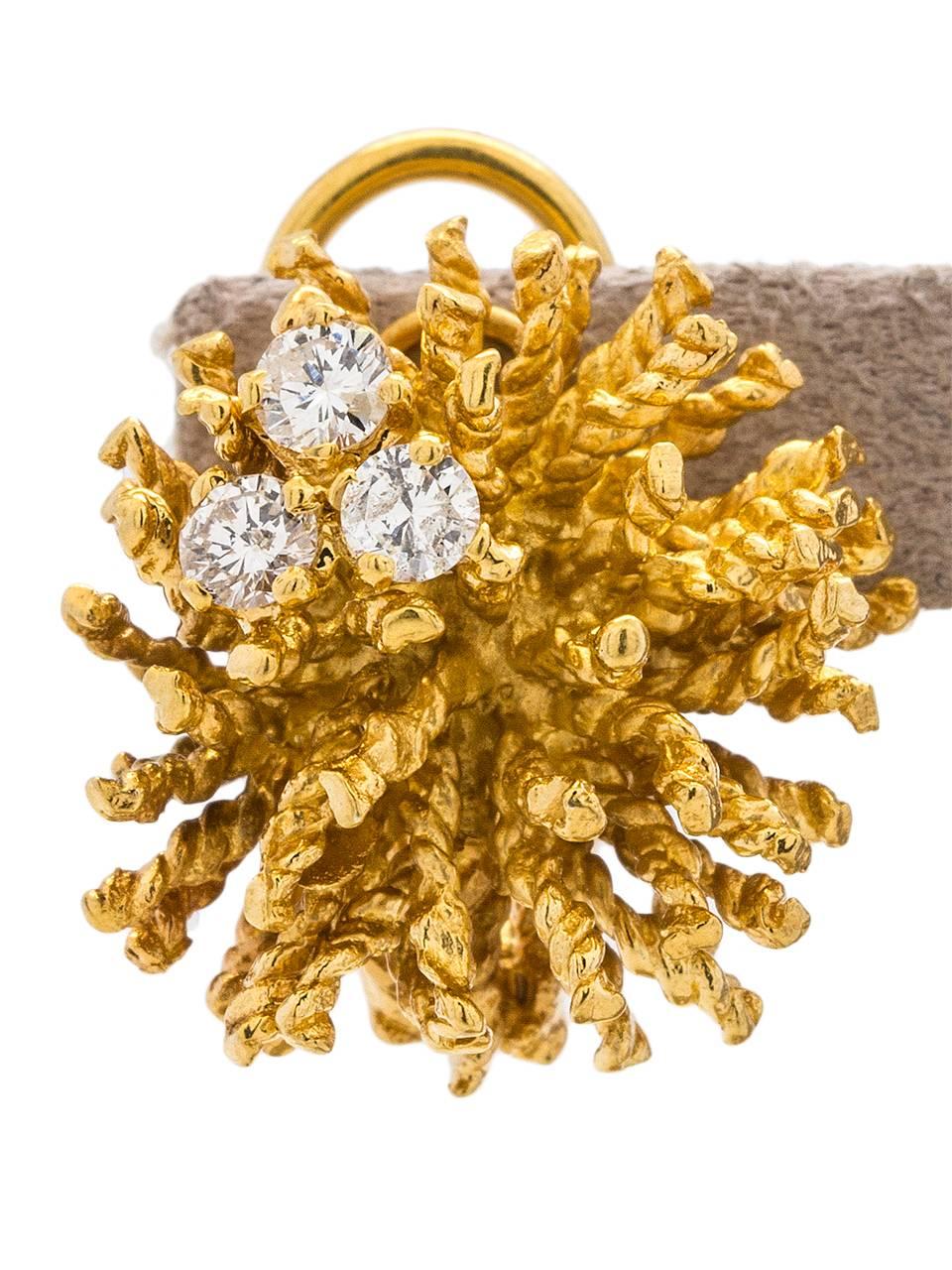 
Fantastic yellow gold “Sea Urchin” lever-back clip earrings (no posts), reminiscent of Tiffany & Co. designs of the era. Featuring six full-cut round brilliant diamonds with a total weigh of approximately 0.60ct, G-H/SI-I3. Each earring measures