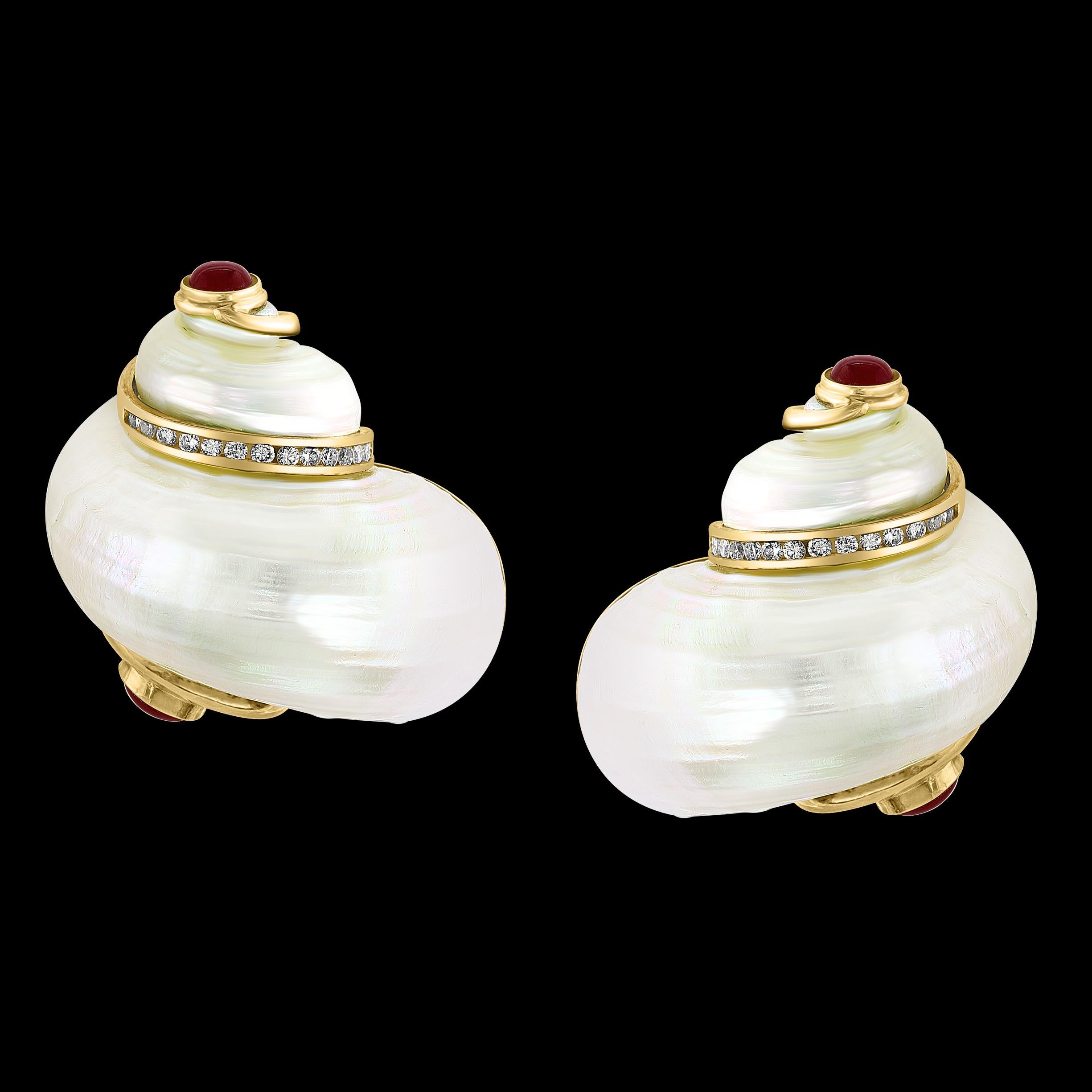 Vintage Seaman Schepps 18KT Gold Turbo Shell Diamond Ruby Earrings Extra Large
Vintage Seaman Schepps 18KT Yellow Gold Turbo Shell Diamond and Ruby extra large earrings. Earring contain diamonds and rubies. They weigh 52 grams. We do not have the