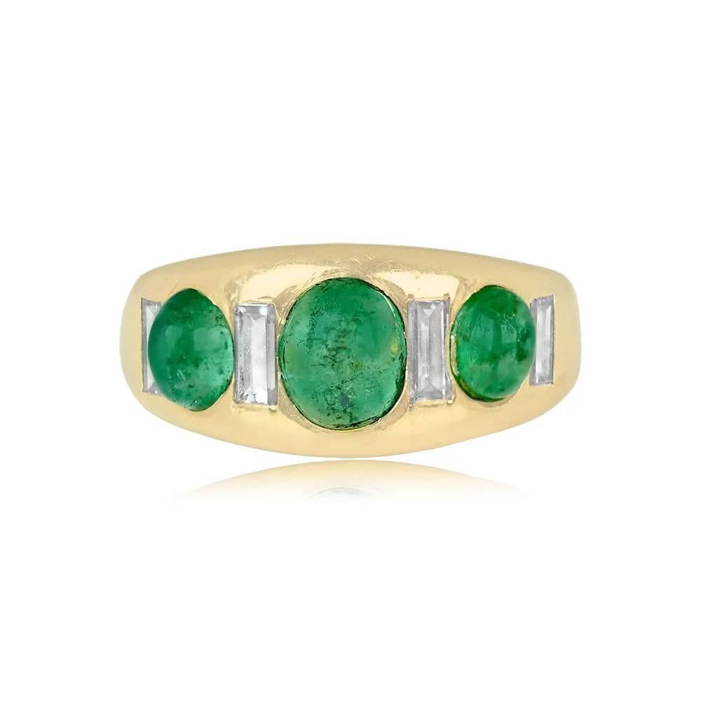 A vintage Seaman Schepps ring showcasing cabochon emeralds and baguette-cut diamonds in an alternating pattern. The emeralds weigh around 2.00 carats, and the combined weight of the diamonds is approximately 0.40 carats. Handcrafted in 18k yellow