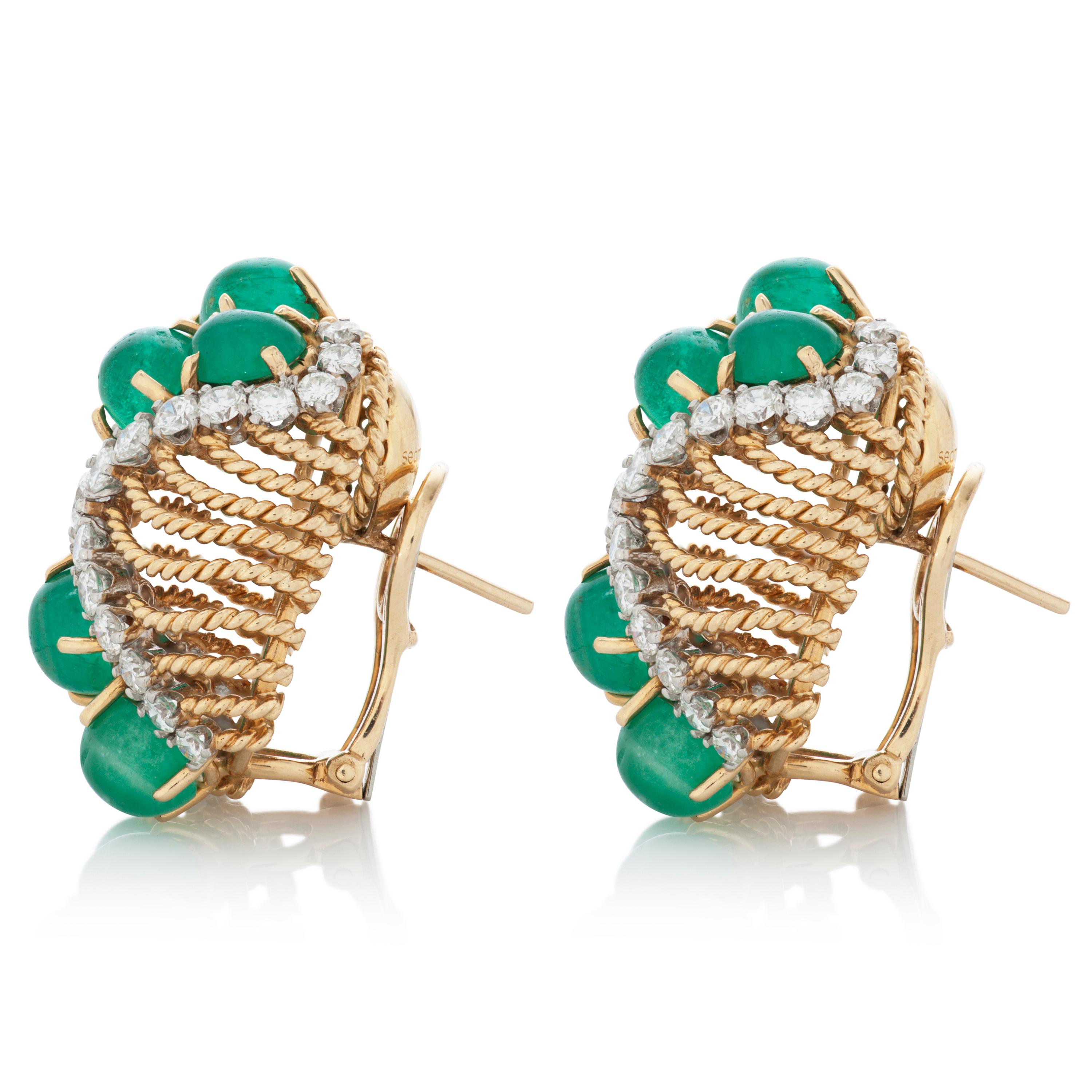 This pair of vintage Seaman Schepps earrings feature 12 cabochon emeralds totaling approximately 13 carats set in 18k yellow gold, as well as 3 carats of round brilliant cut diamonds with G-H color and VS clarity set in platinum.

Approximately 30mm