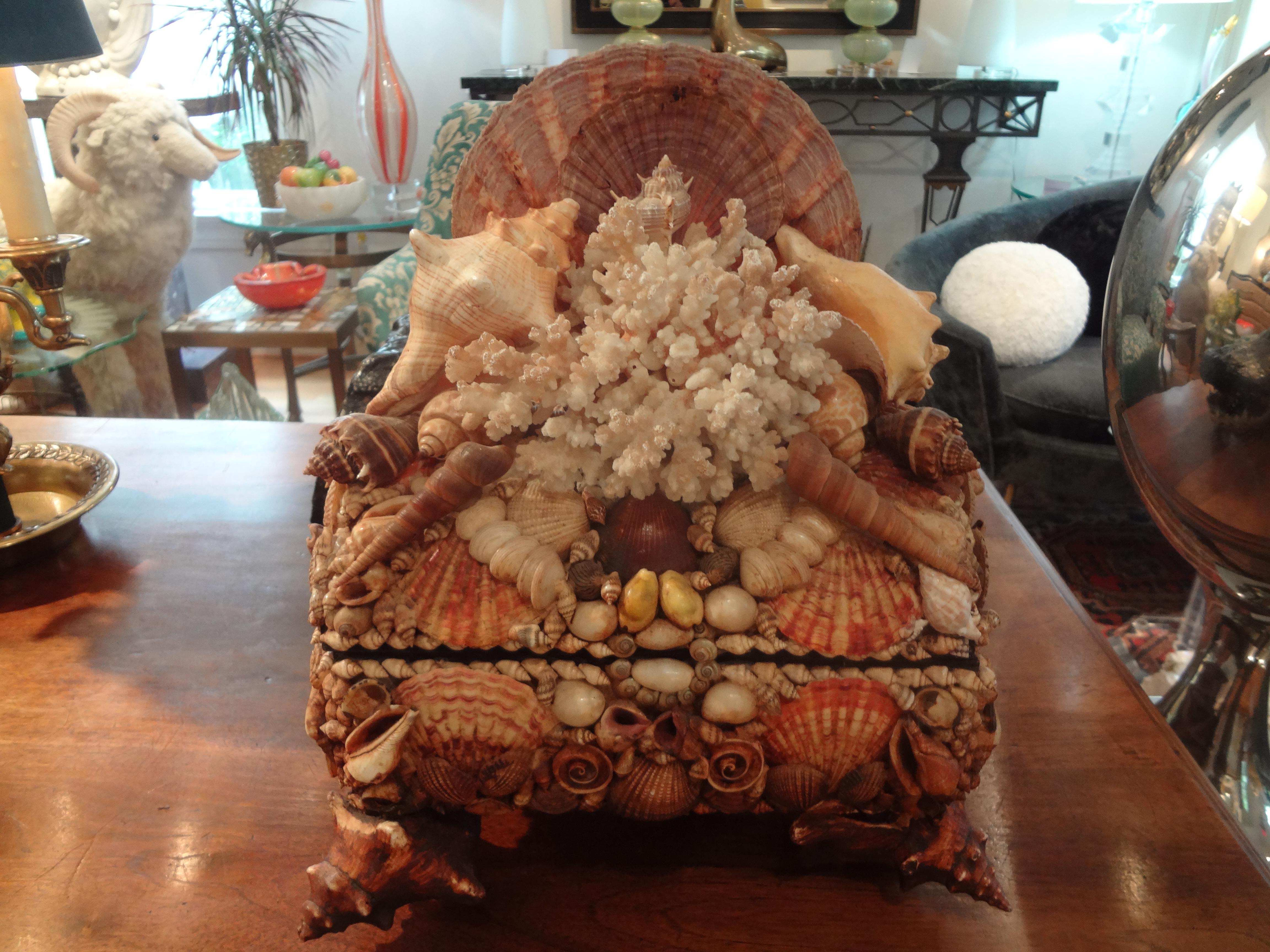 Unusual 20th century decorative box adorned with seashells and coral. This fabulous hand decorated seashell box or jewel casket would make a great cocktail table or powder bath accessory.
