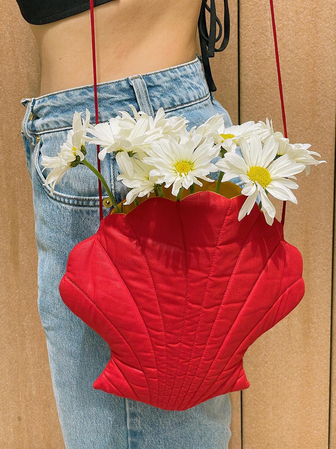 This vintage seashell purse is so sweet! I have a soft spot for anything shell-shaped, and I love that this bag is slightly quilted, with seams to emphasize the shape of a scallop shell. The bright red color is a surprisingly versatile addition to