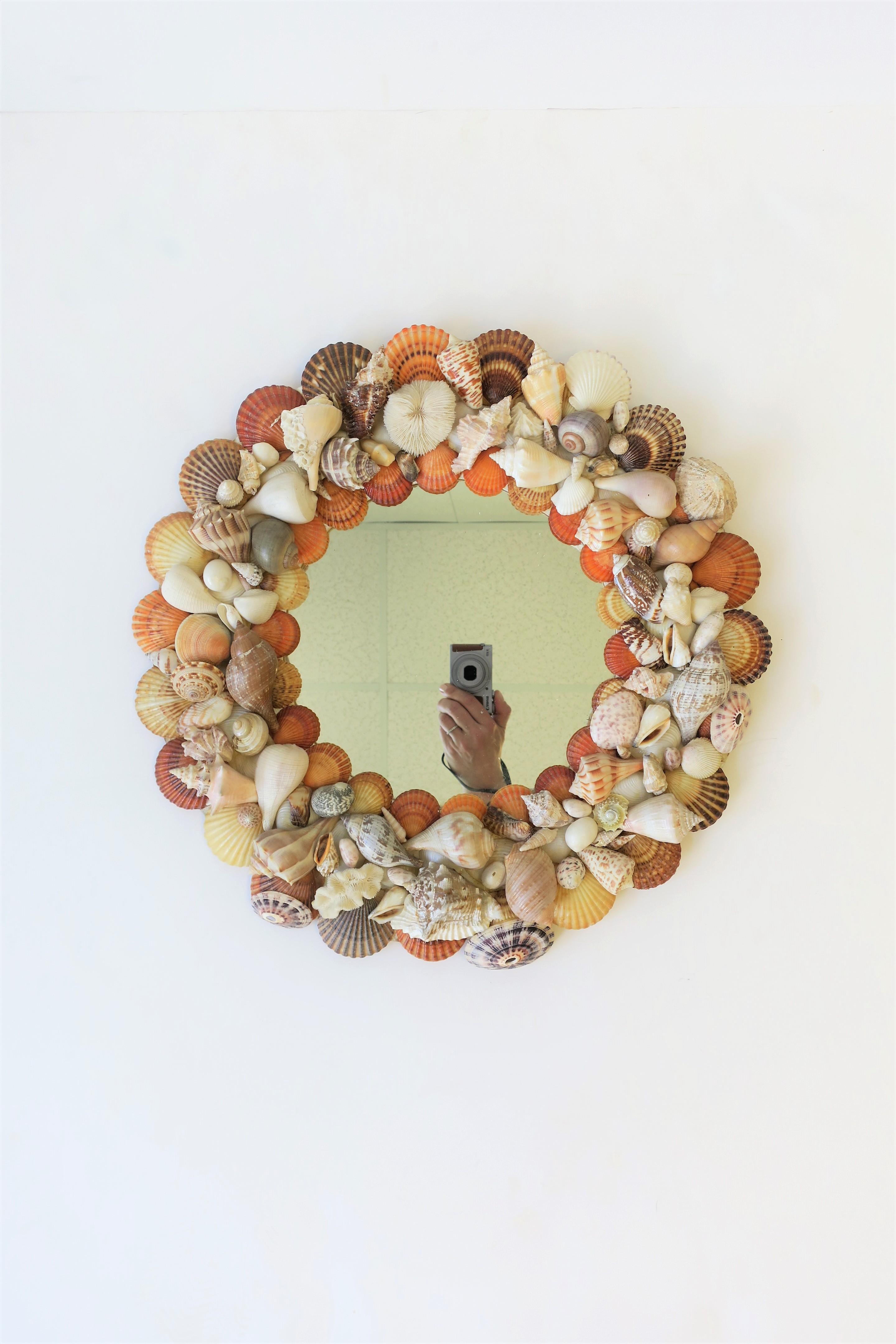 A beautiful vintage seashell/sea shell round wall mirror, circa 1970s. Many beautiful seashells around this mirror. 

Mirror measures: 2