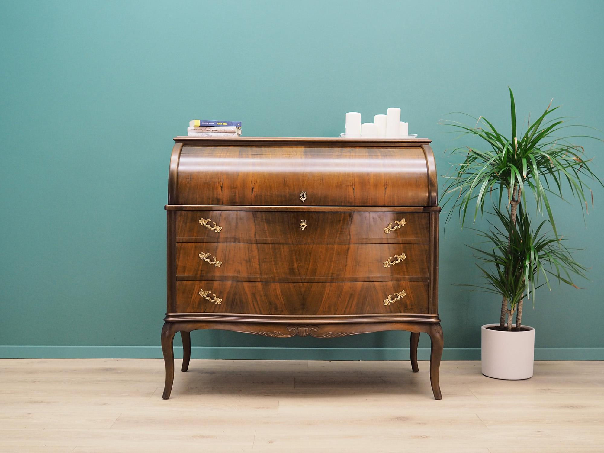 Superb secretary from the 60 / 70's. Danish design, minimalist form. Furniture is covered with walnut veneer, legs made of solid walnut wood. Secretary has three capacious drawers in the lower part and a pull-out bar and four drawers in the upper