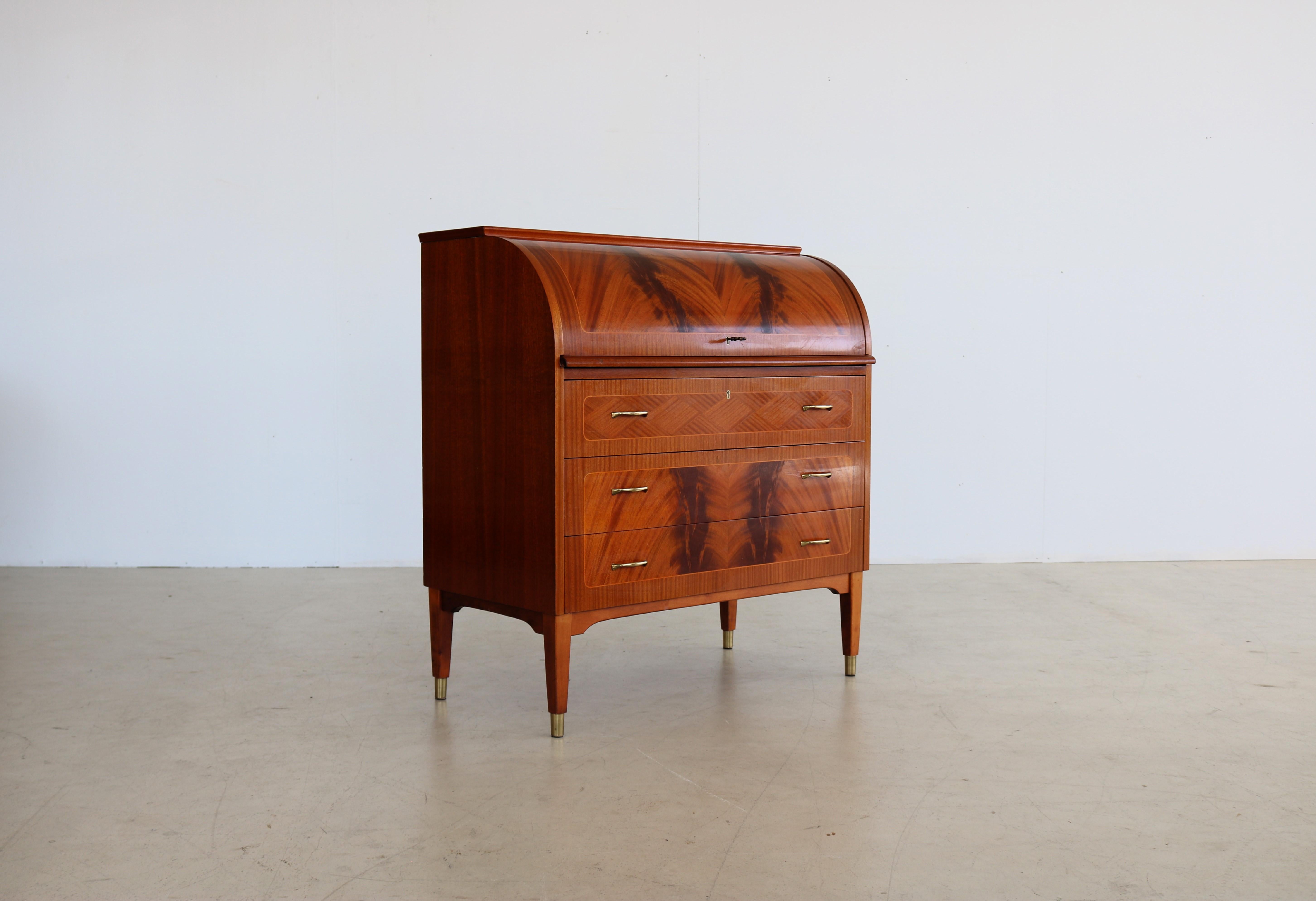 vintage secretary desk cabinet 60s Ostergaard

period 60s
designs Egon Ostergaard SMI Sweden
conditions good light signs of use
Size 97 x 90 x 47 (hxwxd)

details teak; roll top;

article number 2041.