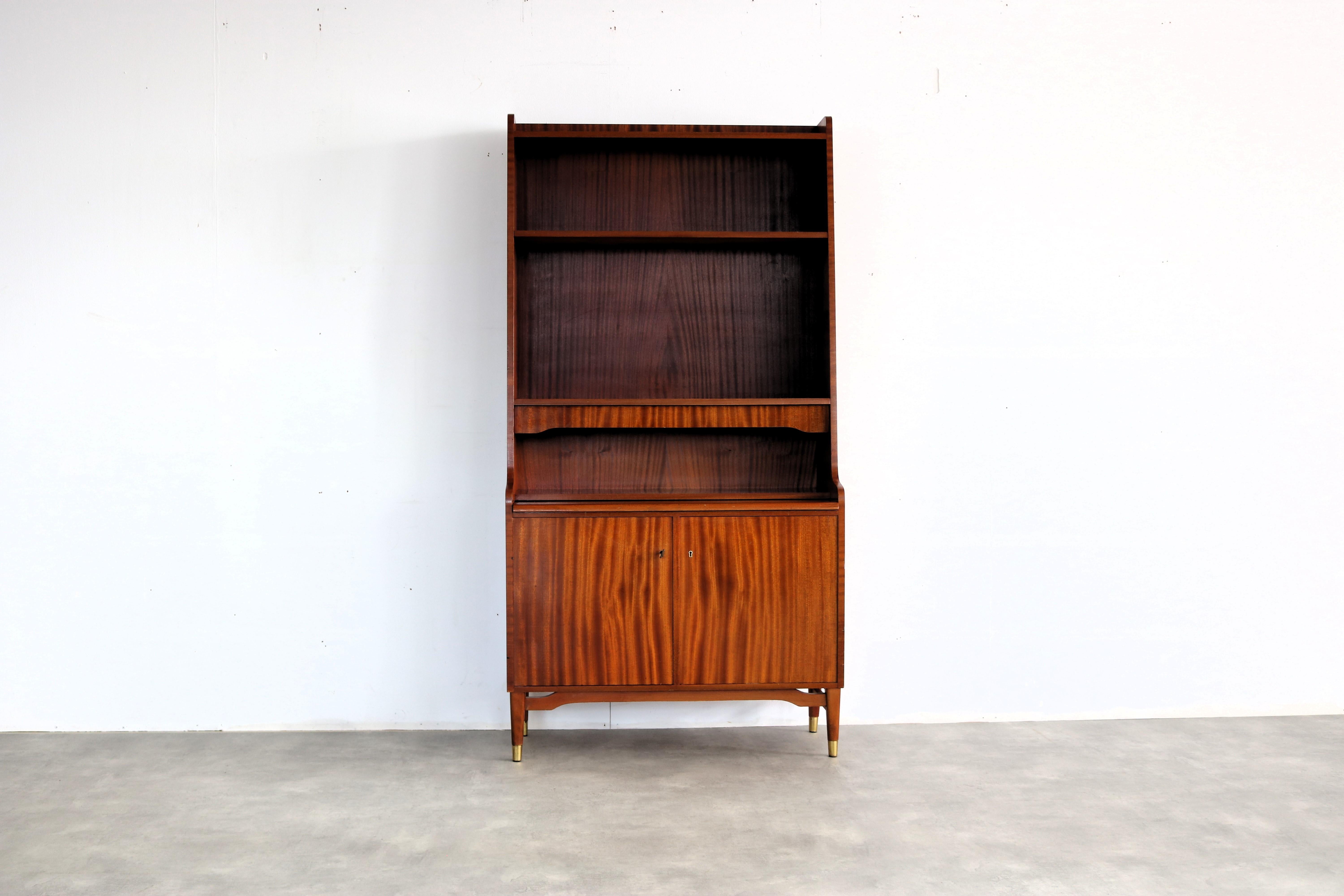 vintage secretary | wall cupboard | 60s | Sweden

period | 60's
design | unknown | Sweden
condition | good | light signs of use | veneer traces on the back
size | 186 x 95 x 42 (hxwxd)

details | teak; brass;

article number | 2185