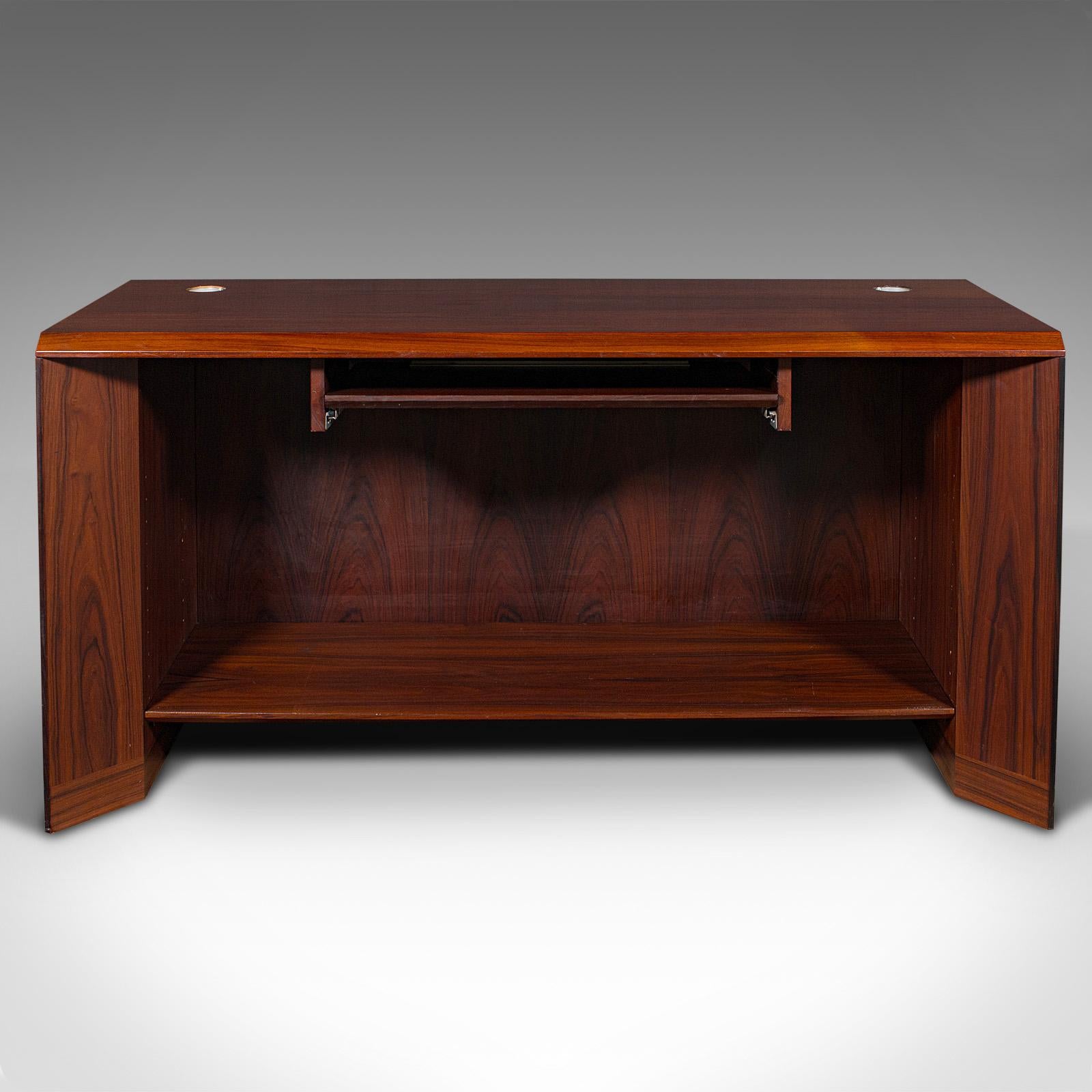 This is a vintage secretary's desk. A Danish, rosewood narrow office table by Sibast Mobel, dating to the late 20th century, circa 1970.

Sibast Mobel was founded by Helge Sibast (1908 - 1985) a Danish craftsman with an eye for mixing tradition and