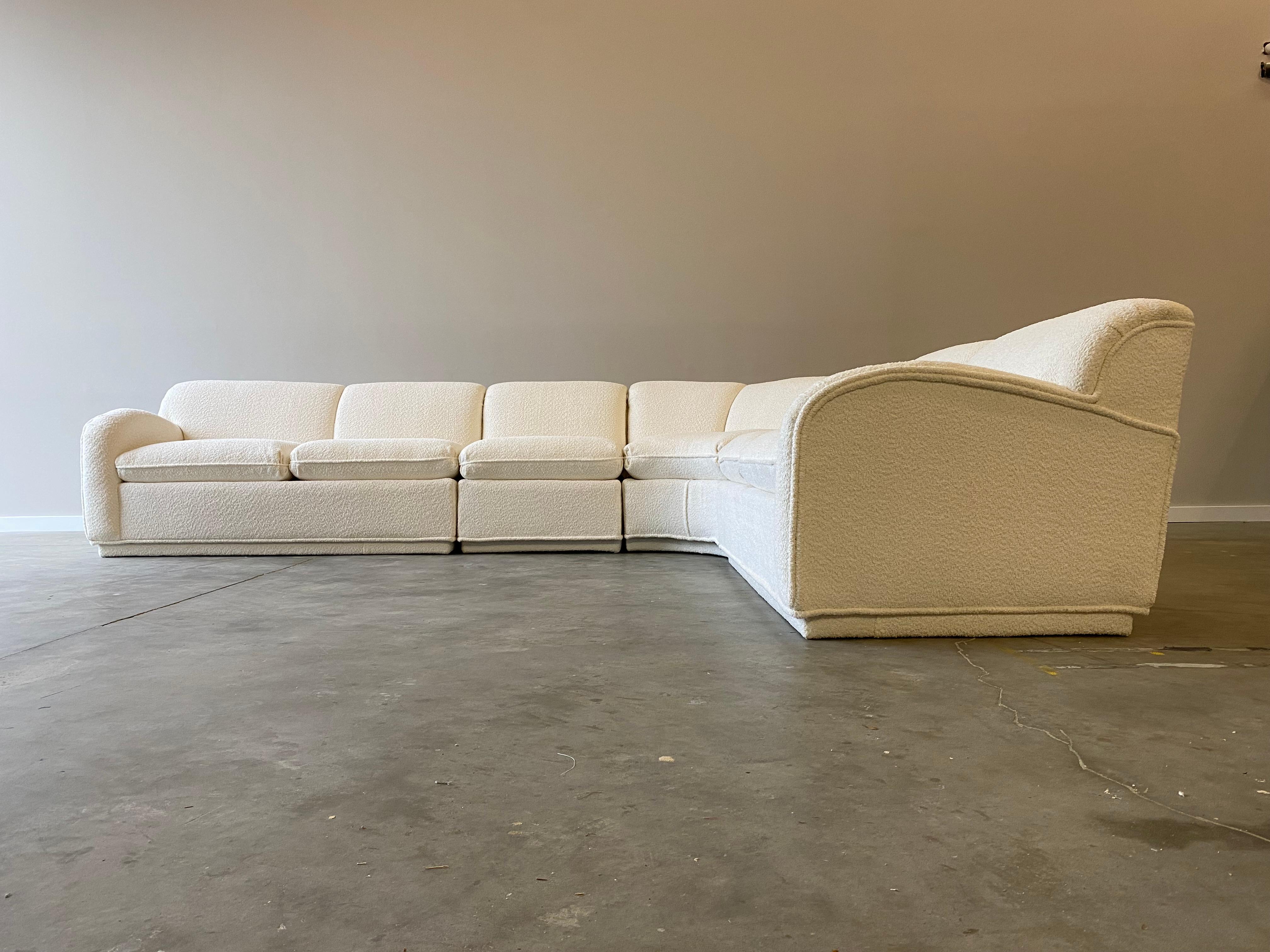 An incredible vintage sofa, newly upholstered in a plush fabric. Unique thick piping and deep comfortable seats to this stunning sofa.

This sectional is four pieces. The smallest piece is 30