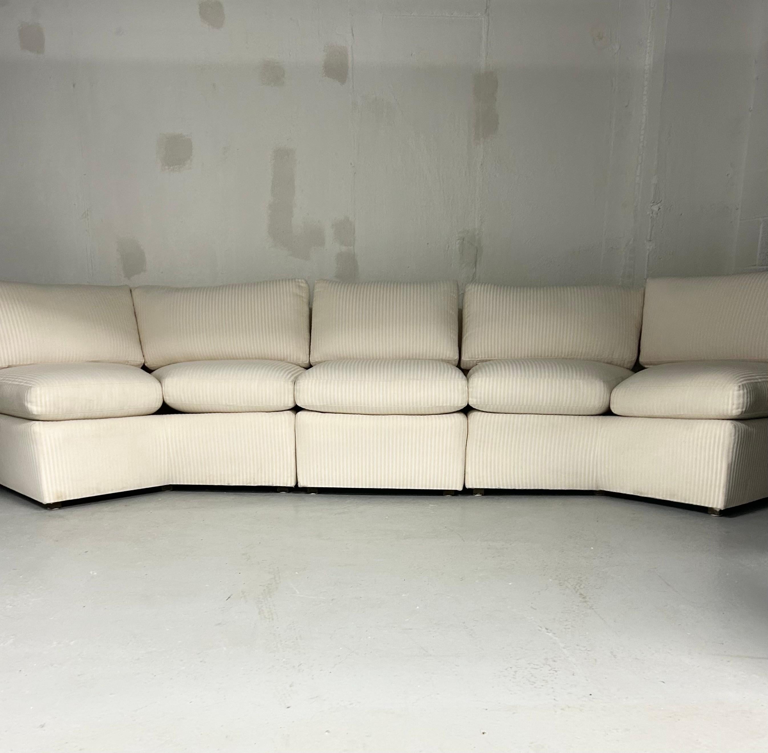 Vintage sectional sofa in off white woven upholstery with textured stripe. So comfy. Can be configured so many ways to fit your space. Minimal wear. Few light marks on back and sides. No manufacturer tag.

135” length but can curve to break up