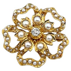 Spilla vintage con perle e diamanti, incastonata in oro giallo 18 carati