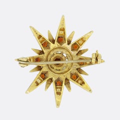 Broche vintage en perles de rocaille et grenat en forme d'étoile