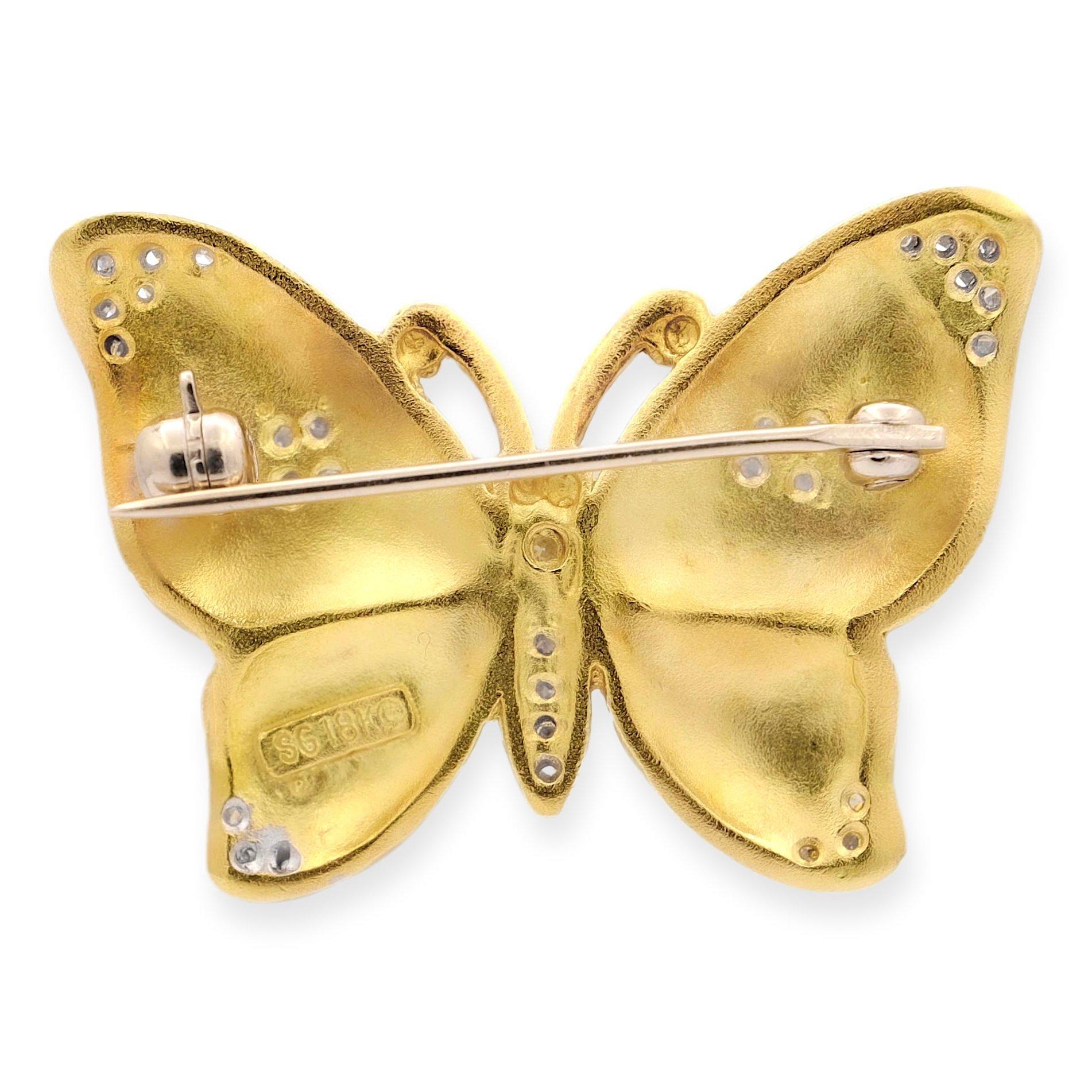 Introducing the Seidengang Brooch: a masterpiece of elegance. Crafted from 18k yellow gold with a satin finish, adorned with approximately 0.33 carats of round brilliant cut diamonds set in white gold. Weighing 9.4 grams, it's a radiant and