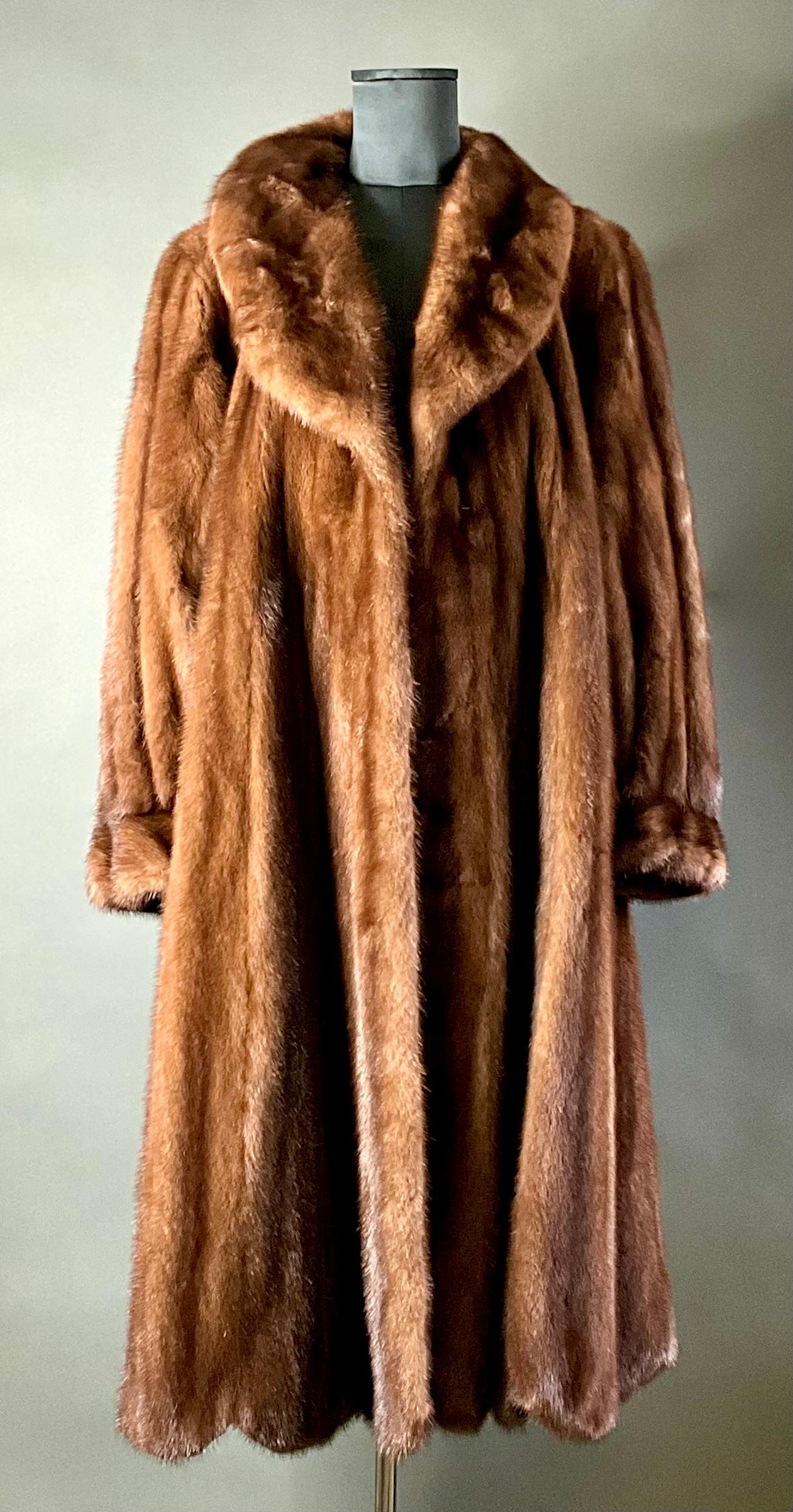 The Vintage Brown Mink Coat  (with detachable collar)  is a timeless, luxurious investment piece that combines warmth, elegance, and vintage charm. Crafted from high-quality fur, this coat provides a rich, silky texture and a flattering silhouette