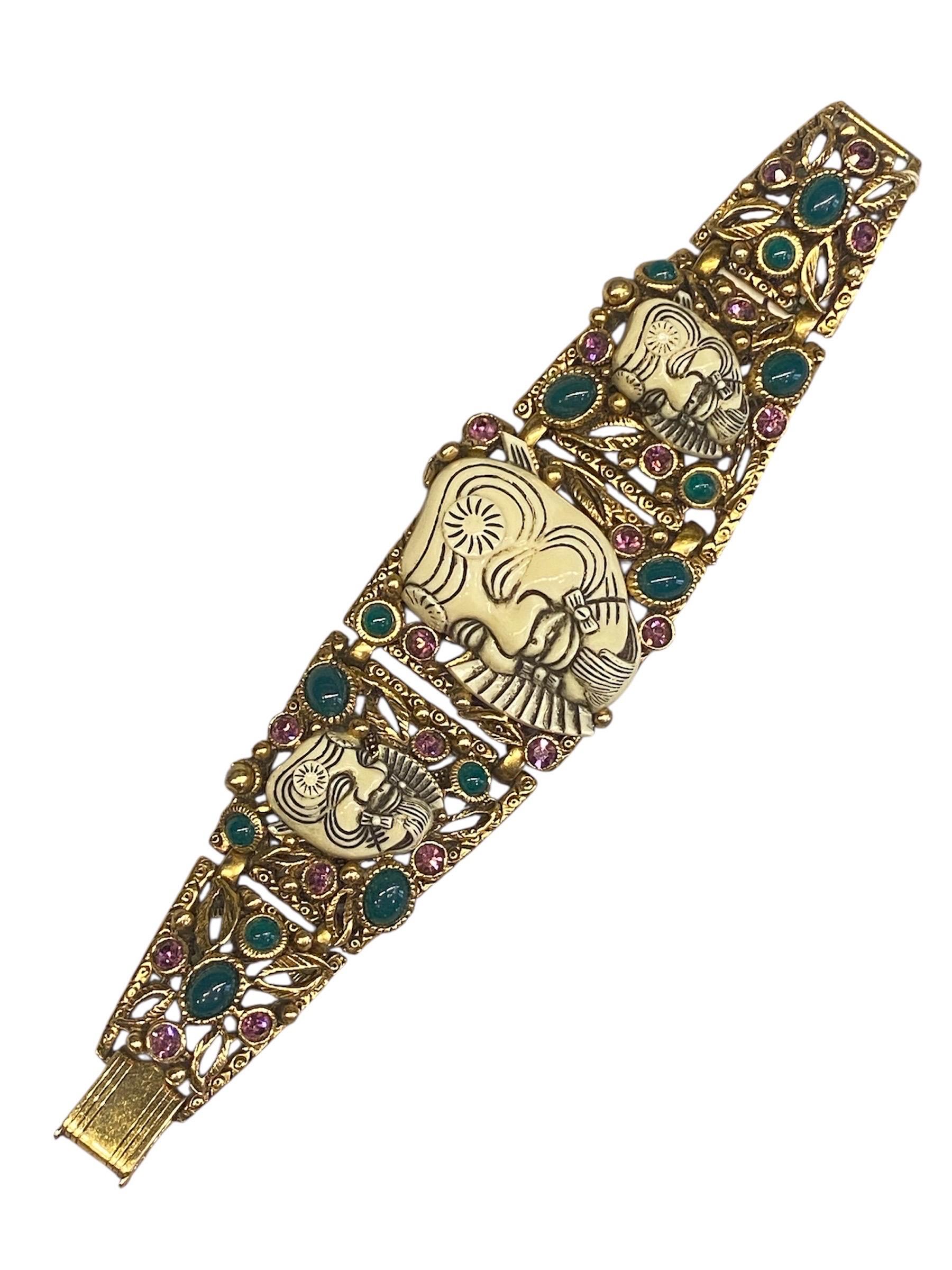 This striking and highly collectible Selro bracelet from the 1950s showcases the brand’s signature dramatic style. The wide, gold-tone metal links feature intricately molded resin “Noh Devil” faces. The faces are inspired by Japanese Noh theater