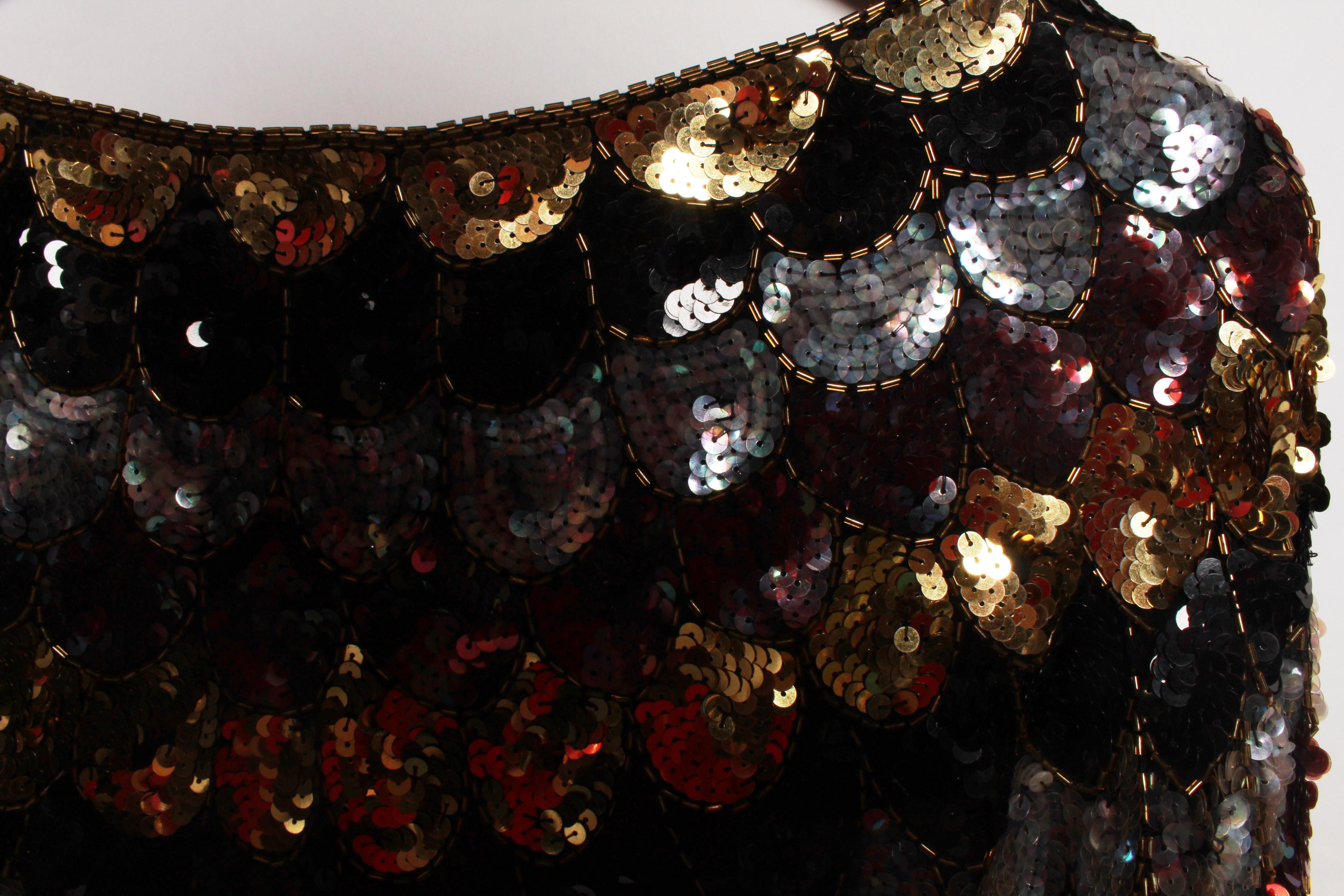 Vintage sequin scallop top with raglan sleeve in a glamorous  colour combination of gold, silver, aubergine and black. 
Fully lined. 
