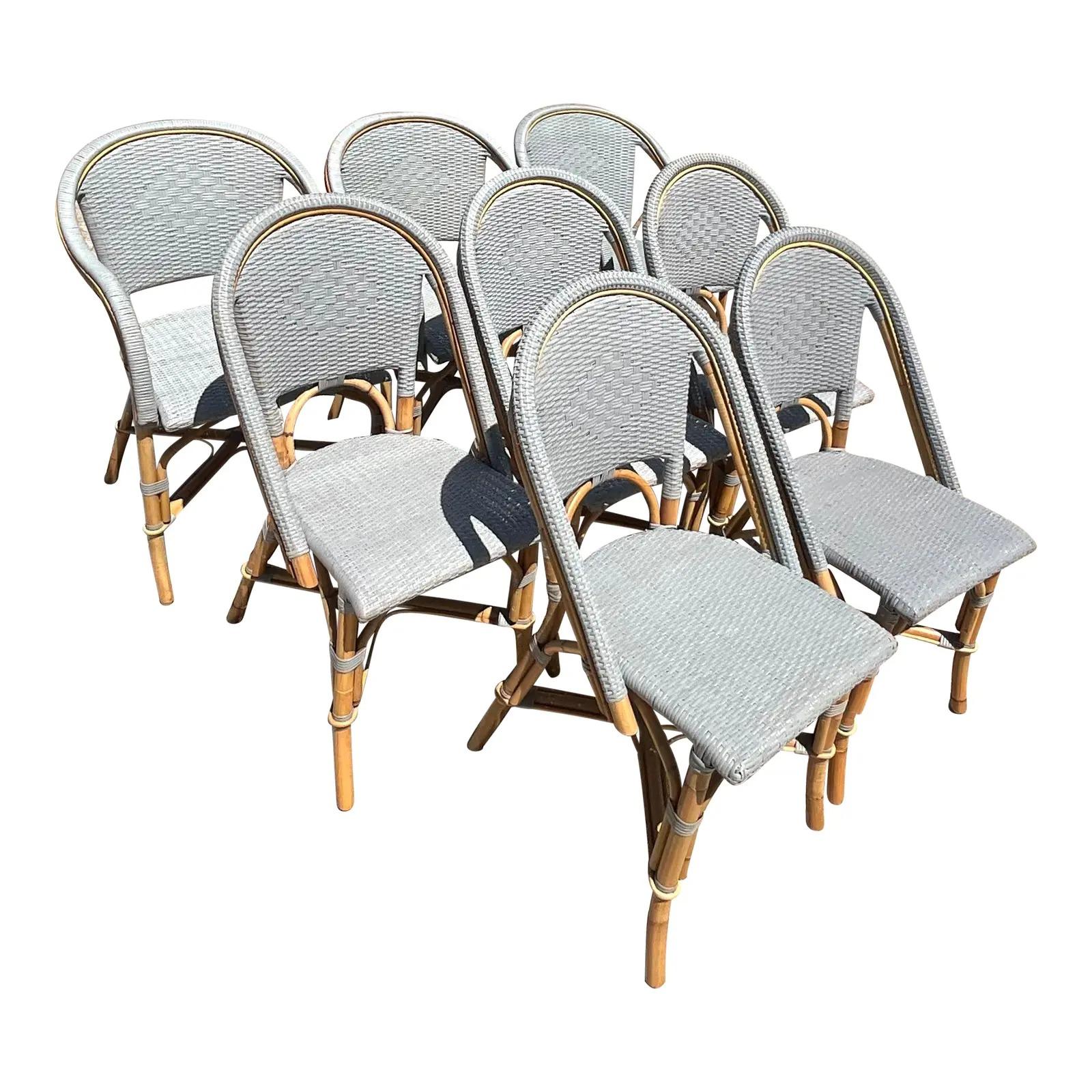 Fantastic vintage coastal set of 8 serena and lily dining chairs. The coveted Riviera woven rattan in sky blue. 3 Arm chairs and 5 side chairs. Acquired from a Palm Beach estate.