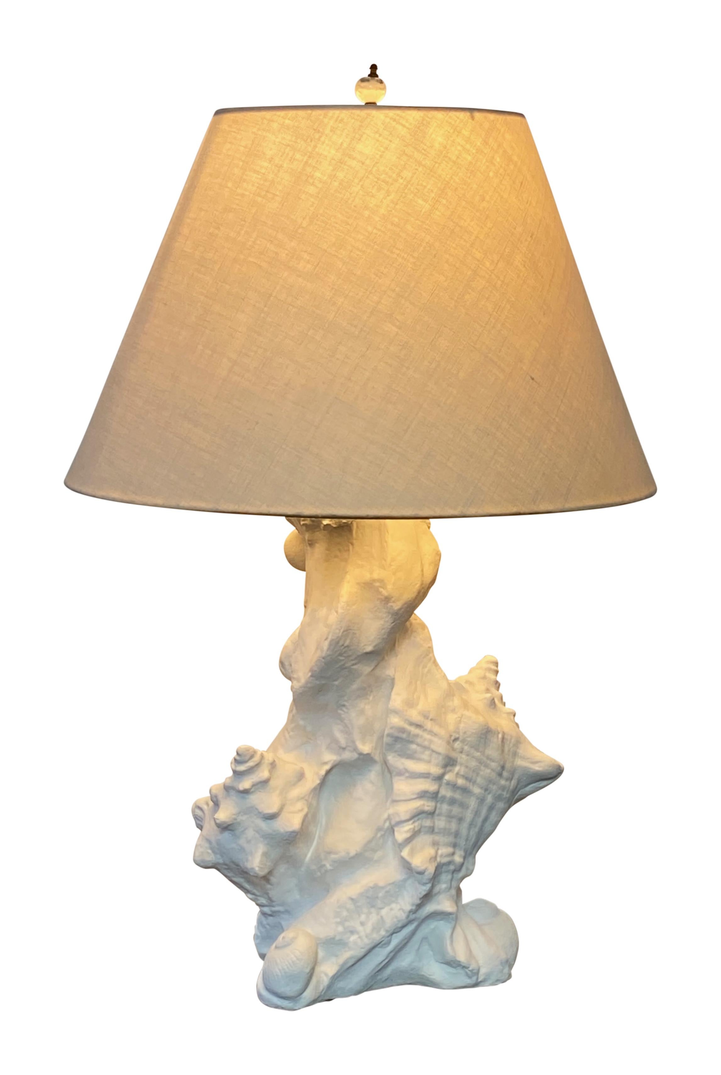 Serge Roche style sculptural seashell table lamp dates to the 1960's. Made of molded plaster composition.
Perfect Coastal or Palm beach look.
In excellent condition.
Recently re-wired.
Shade not included.