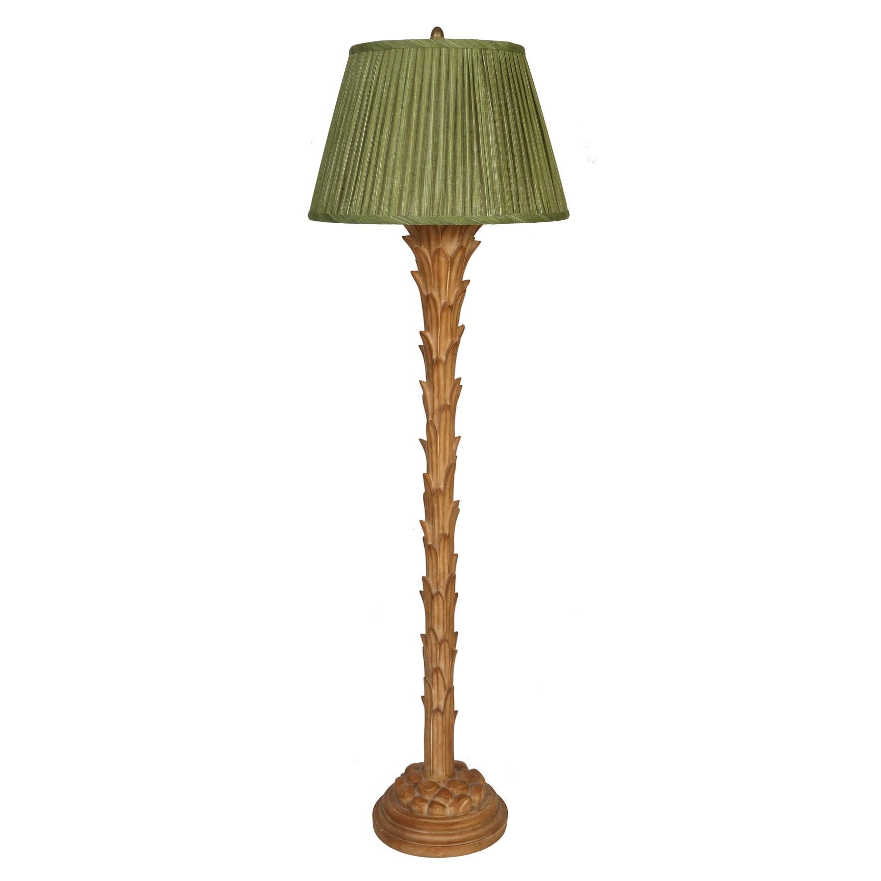 A vintage Serge Roche style palm leaf floor lamp. The standing palm leaf lamp channels the spirit of Roche's distinctive designs, blending opulence and whimsy in perfect harmony. Here the neutral toned floor lamp column  takes on the form of palm