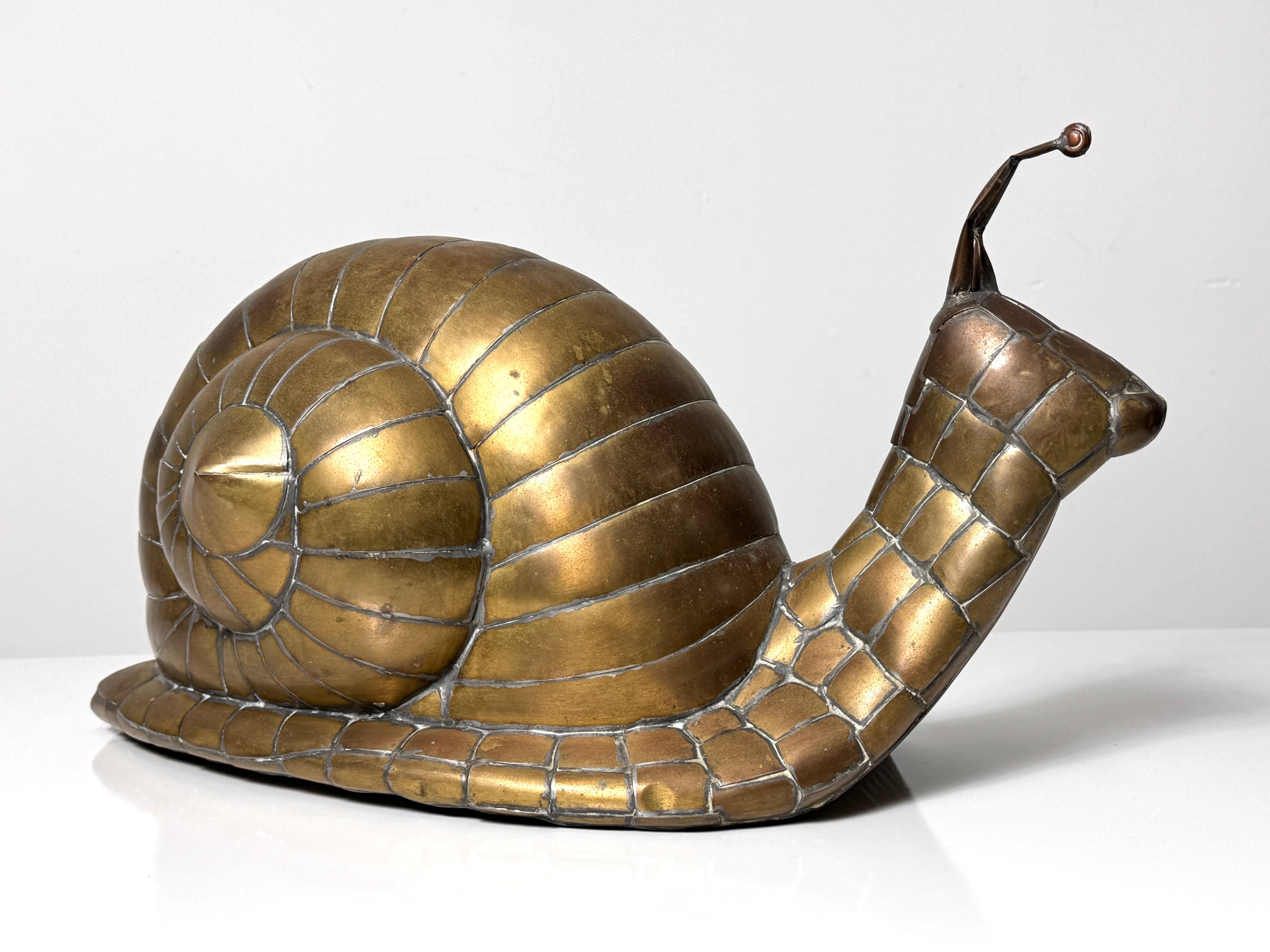 Sergio Bustamante rare snail sculpture Mexico 1970s

Hollow form brass welded construction with great detail and character
Unmarked

19 inch width
9 inch depth
10 inch height