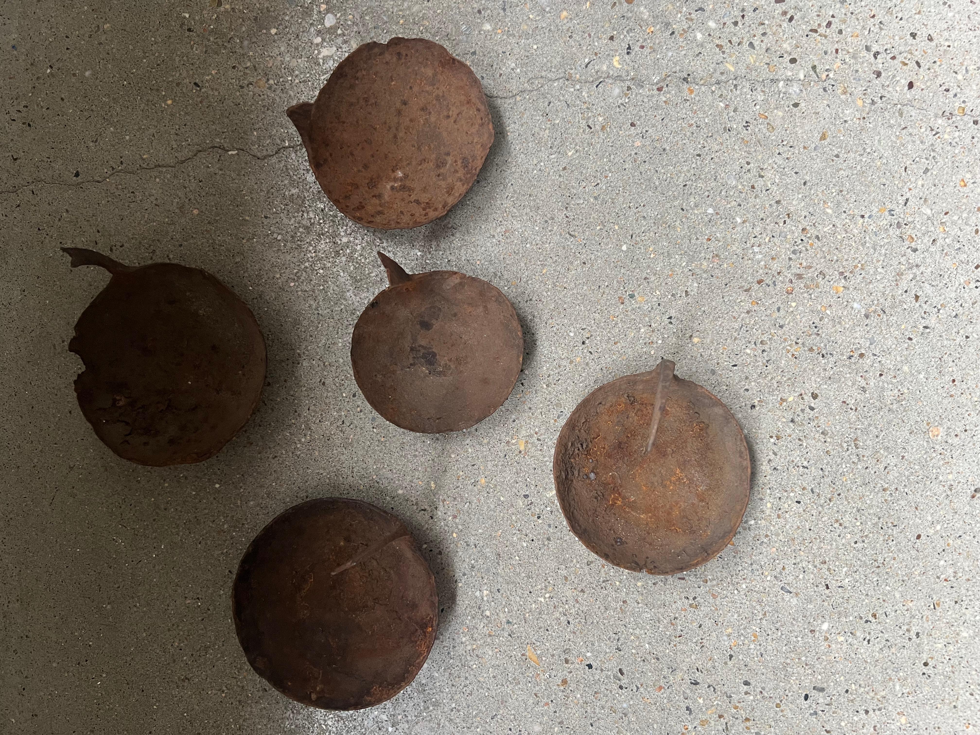 The rust on these oil burners can add character and a sense of age to the collection. The patina tells a story of the wear and tear these burners endured over the years, giving them a weathered and vintage aesthetic.

Collection of 5, ranging in