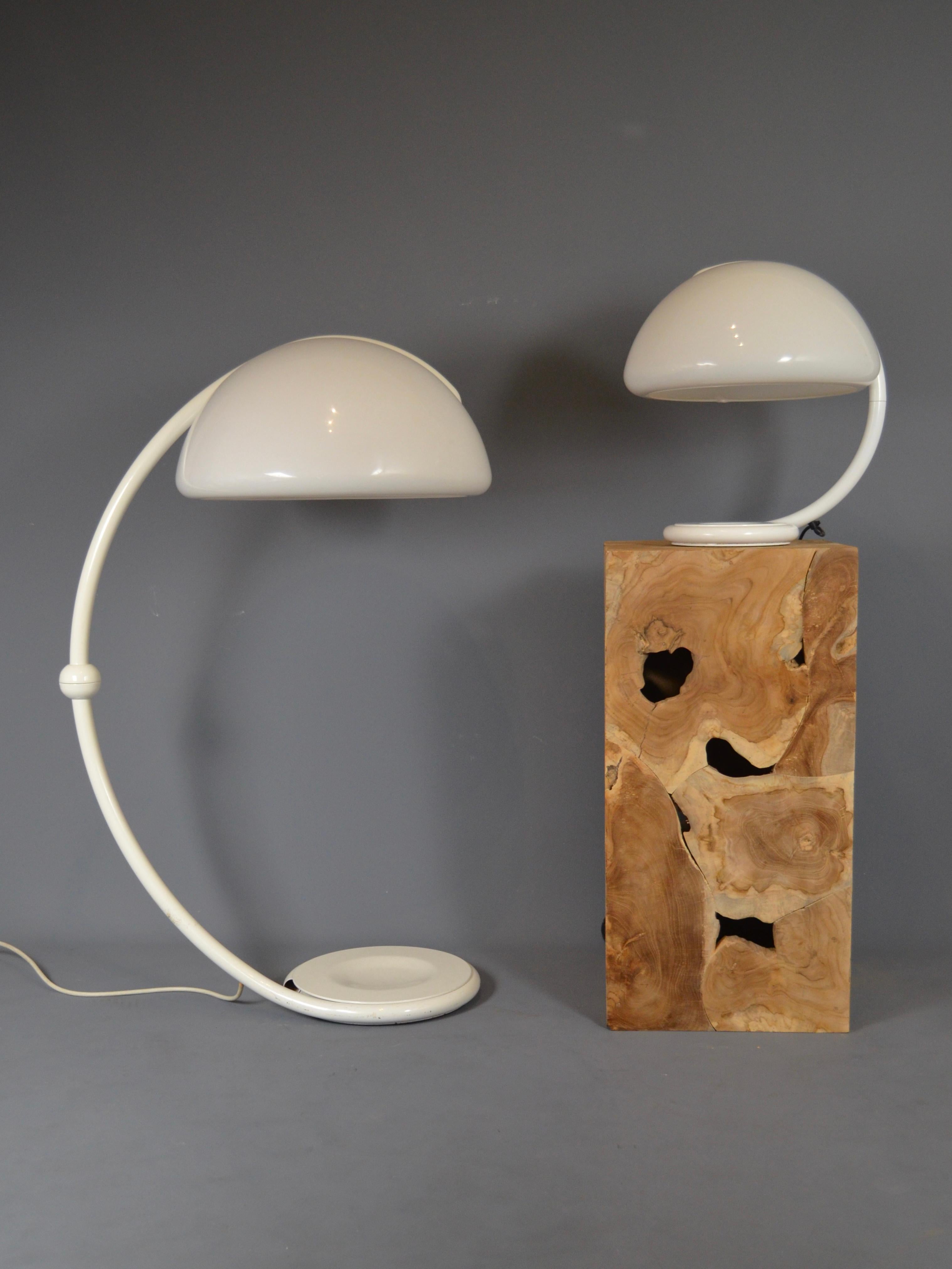 Iconic Serpente floor lamp by Martinelli Luce, 2131 model. The plastic globe is in very good condition and features the brand's label inside. The white lacquered metal frame shows very slight signs of use. The lamp as a whole is in very good