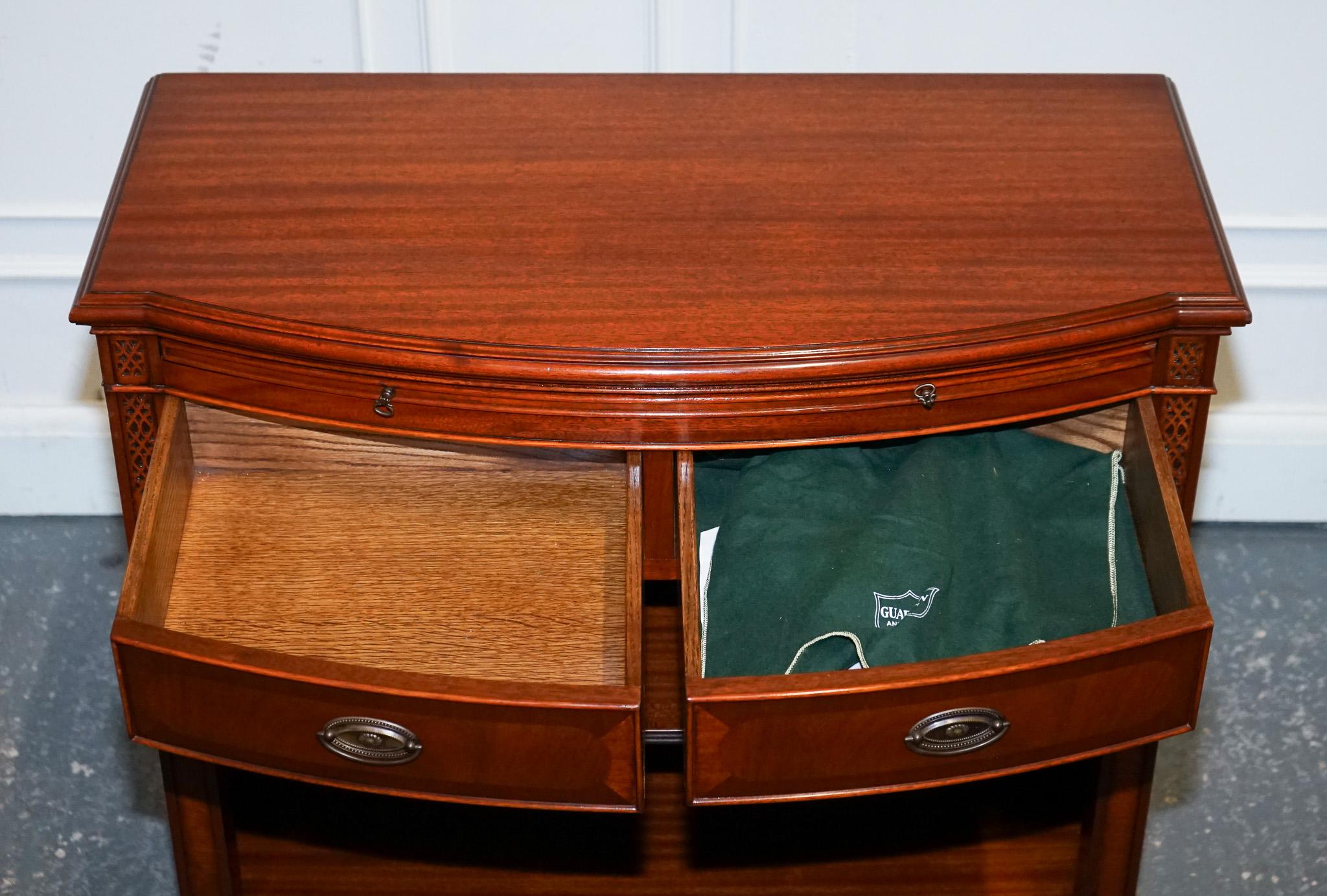 Hardwood VINTAGE SERPENTINE BOW FRONT DWARF OPEN BOOKCASE WiTH TWO DRAWERS BY WADE For Sale