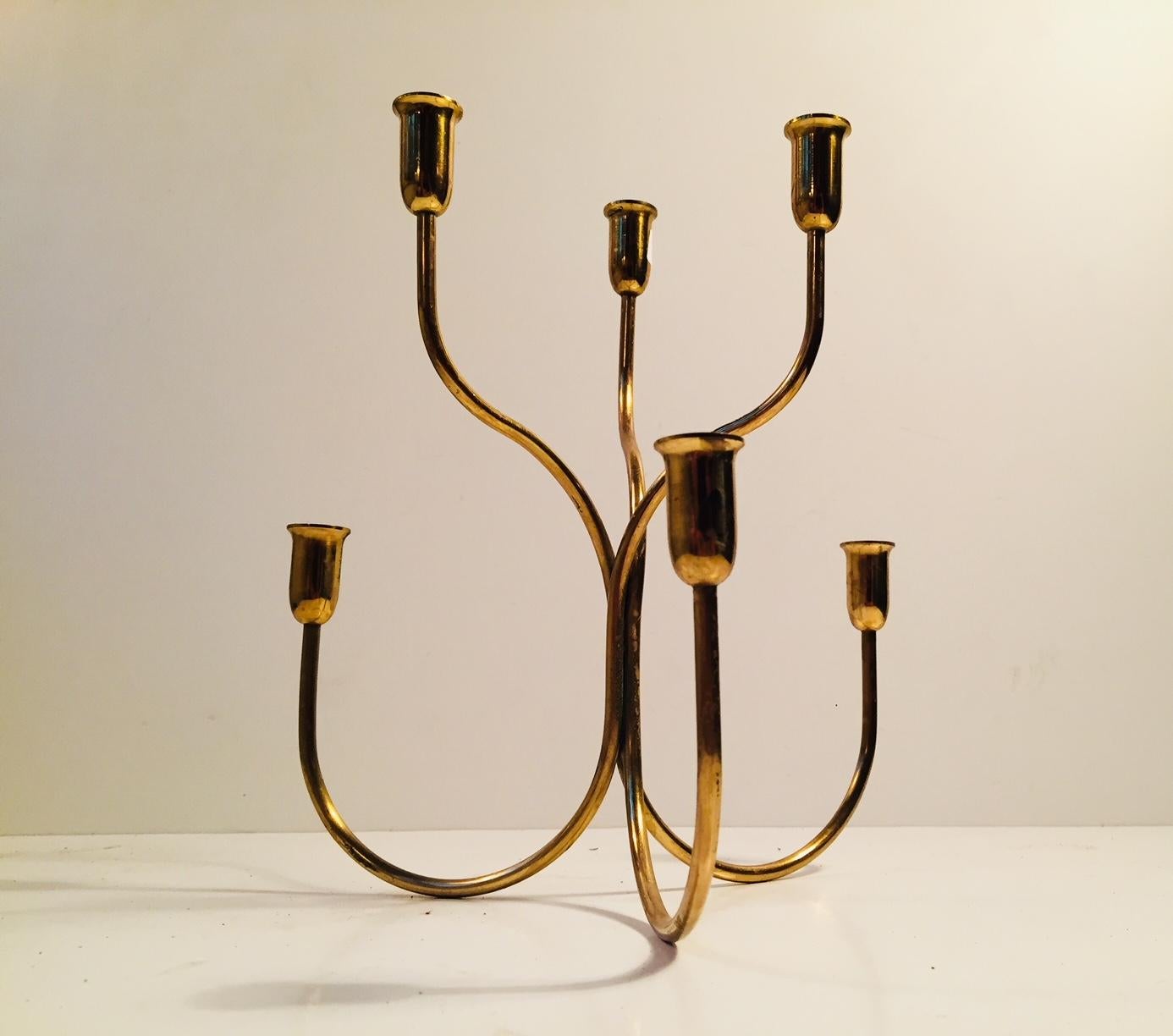 Two tiered serpentine candle holder in wire brass designed by Josef Frank and manufactured by Svenskt Tenn in Sweden during the 1960s. Please notice that this version is for thin candles (Diameter approx. 1 cm).