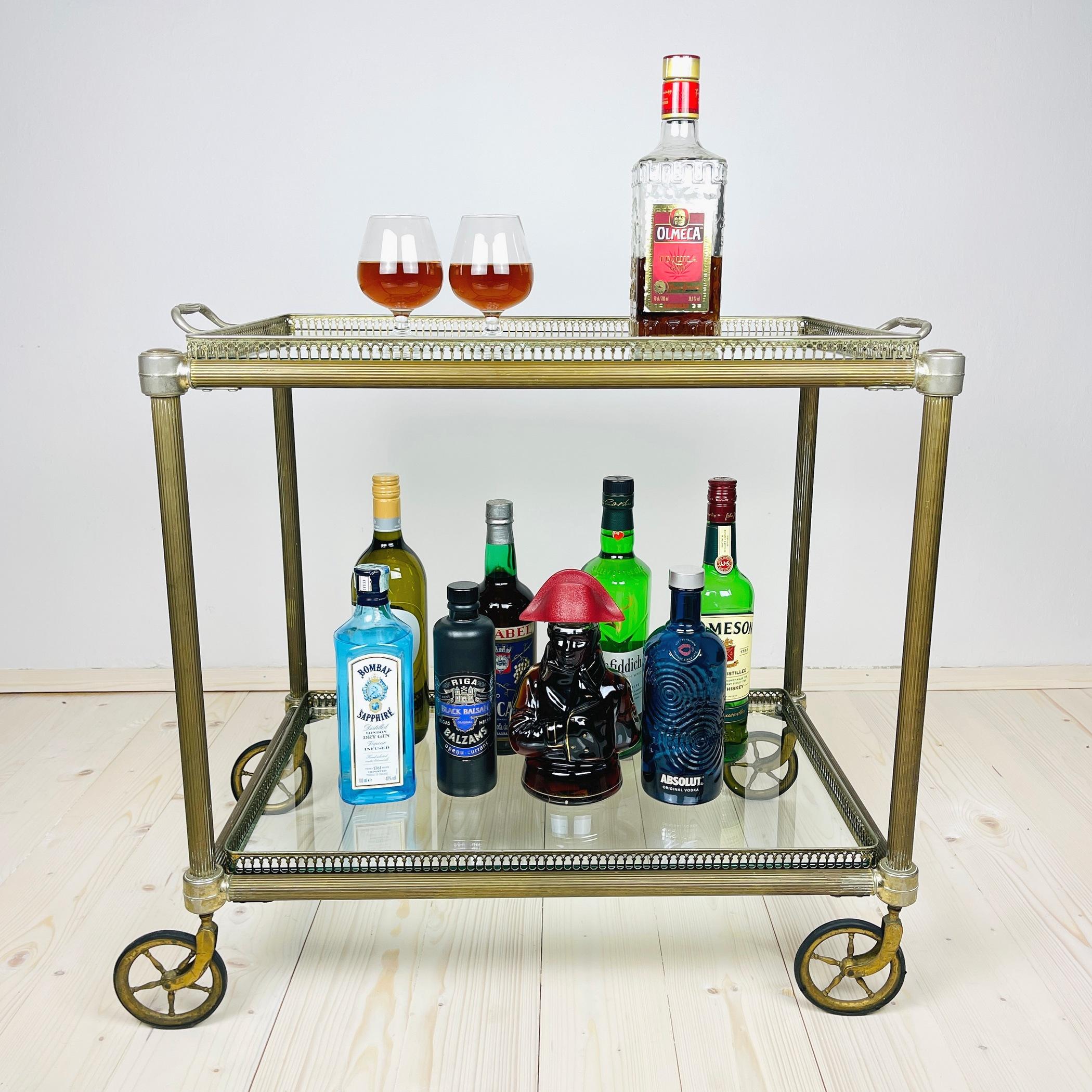 Vintage midcentury Italian trolley made in the 1950s of brass-plated metal, very sturdy, rolls great. This is a perfect vehicle to serve pre-dinner drinks at dinner parties. The wheels are moveable, making them both functional and beautiful! A table