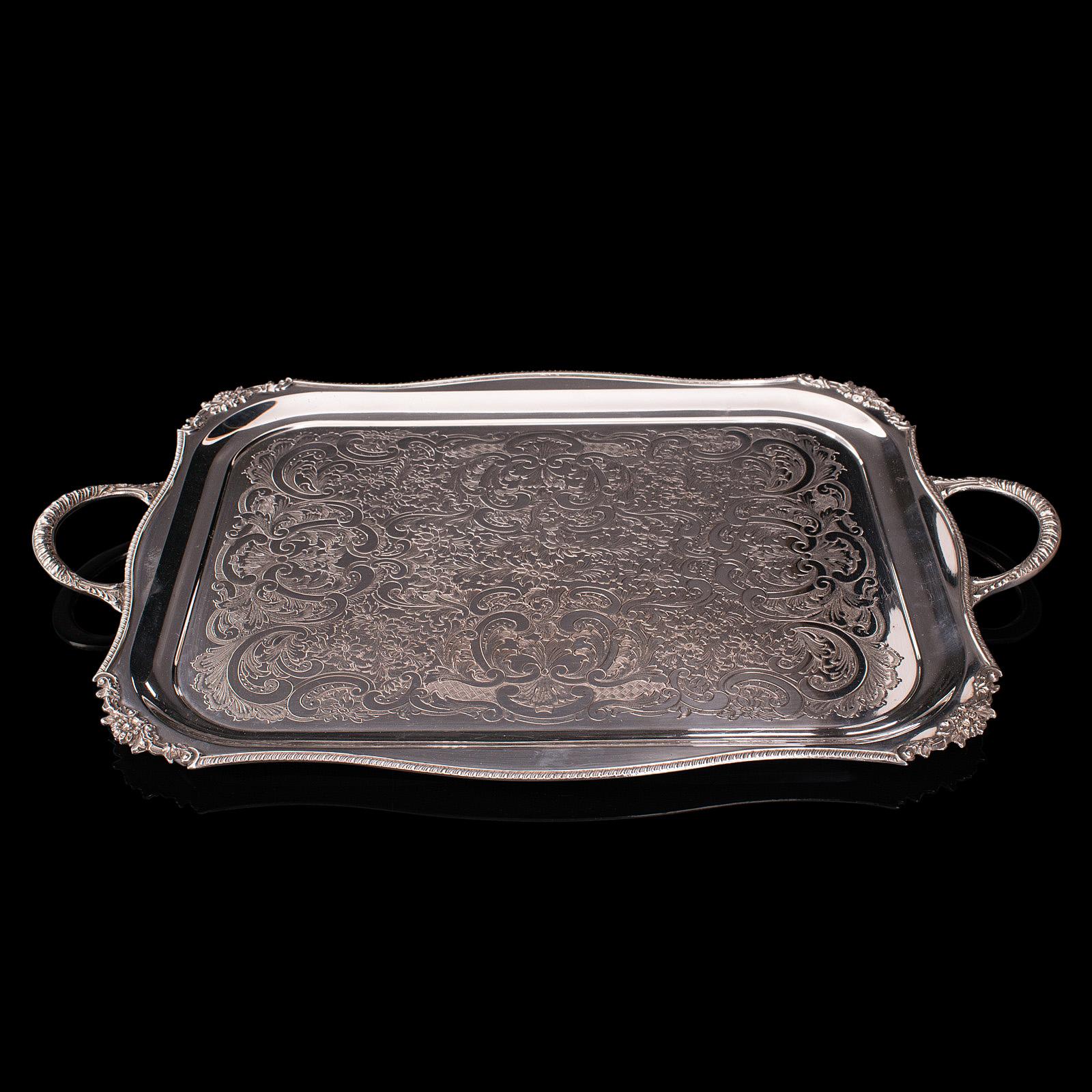 This is a vintage serving tray. An English, silver plated afternoon tea platter by Viners of Sheffield, dating to the mid 20th century, circa 1940.

Profusely detailed and pleasingly ornate tray
Displays a desirable aged patina and in good
