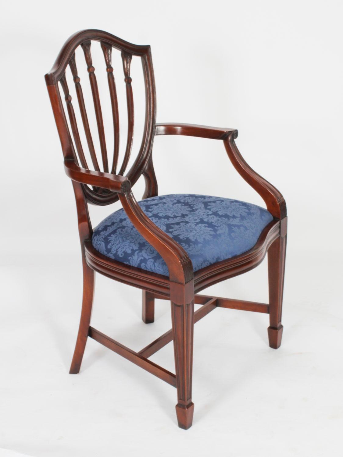 An absolutely fantastic Vintage set of ten Hepplewhite Revival dining chairs.

Beautifully hand crafted from solid mahogany the set comprises eight side chairs and two armchairs, all of which feature an attractive shieldback design and 'drop in'