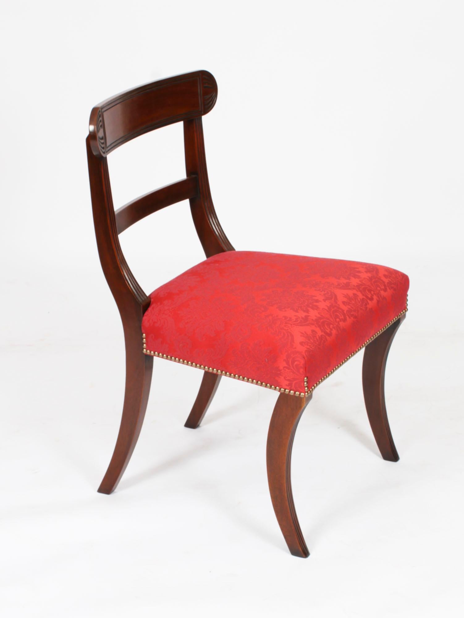 An absolutely fantastic Vintage set of twelve Regency Revival bar bak dining chairs dating from the late 20th century.

These chairs have been masterfully crafted in beautiful solid flame mahogany throughout and the finish and attention to detail