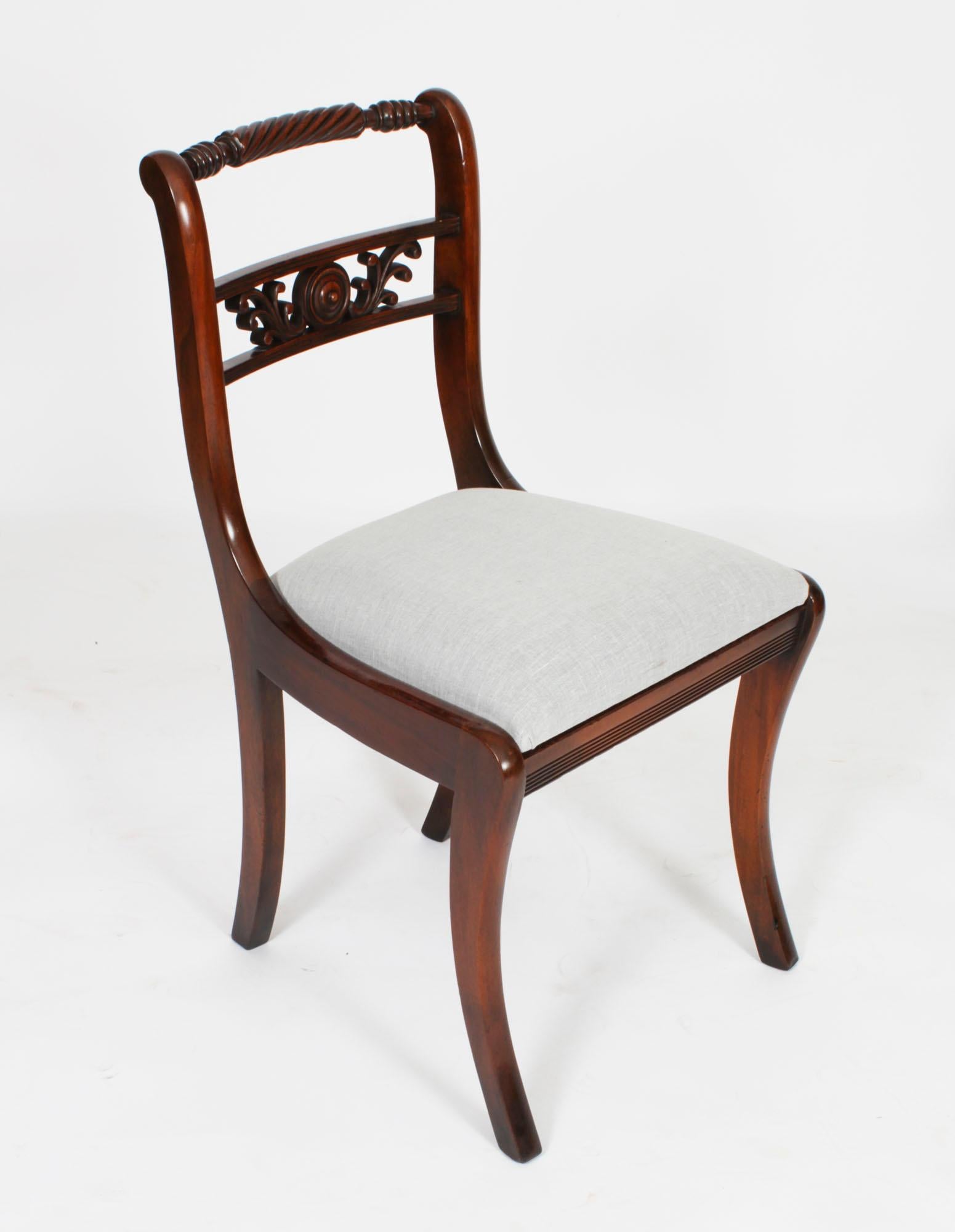 An absolutely fantastic Vintage set of twelve Regency Revival dining chairs dating from the second half of the 20th century.

These chairs have been masterfully crafted in beautiful solid flame mahogany throughout and the finish and attention to