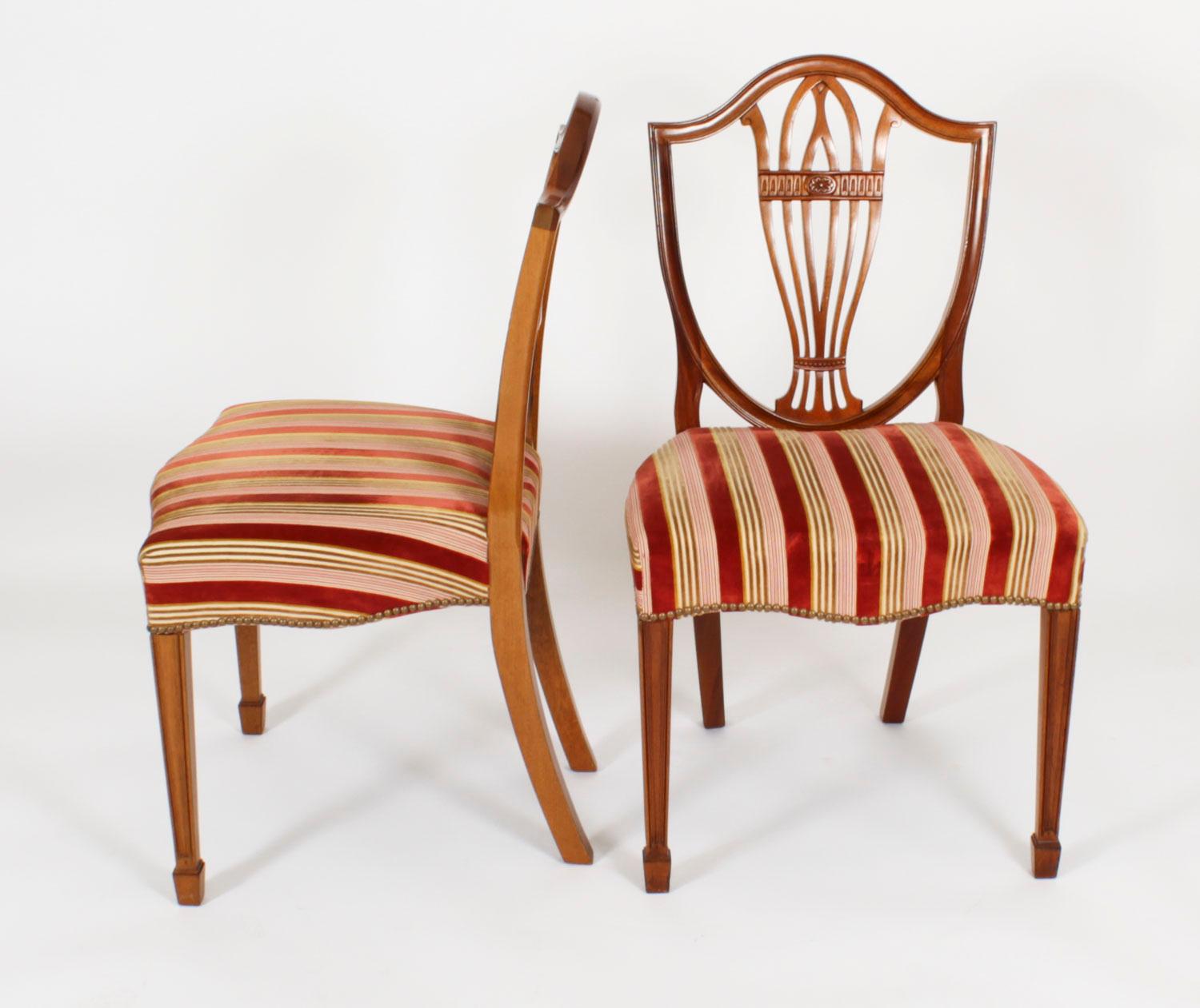 This is  a fabulous Vintage set of twelve mahogany Hepplewhite shield back dining chairs by William Tillman, Circa 1980 in date.

Purchased at great expense from the master cabinet maker William Tillman, Crouch Lane, Borough Green Kent in the