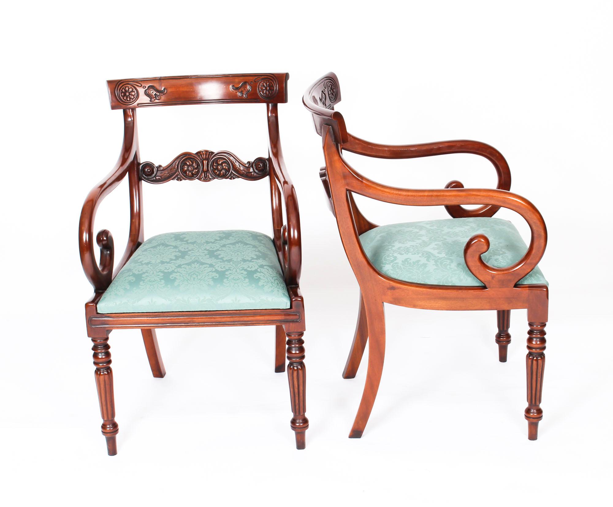An absolutely fantastic vintage set of twelve Regency revival bar back dining chairs dating from the late 20th century.

Masterfully handcrafted in beautiful solid flame mahogany, the finish and attention to detail on display are truly