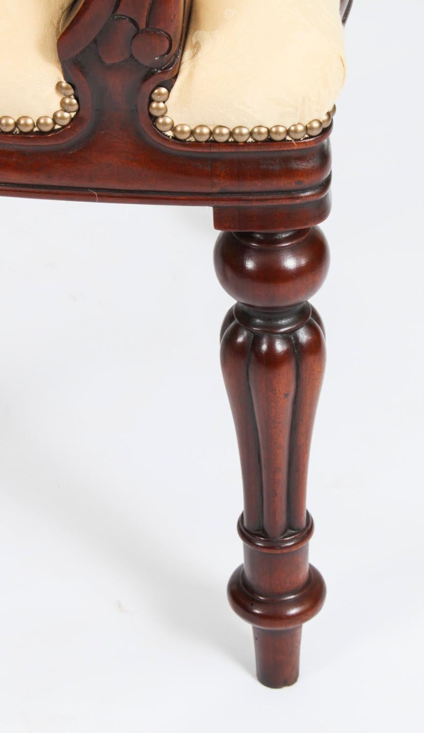 This is an absolutely fantastic vintage set of  twelve balloon back dining chairs dating from the late 20th Century.

These chairs have been masterfully crafted in beautiful solid mahogany throughout and the finish and attention to detail on display