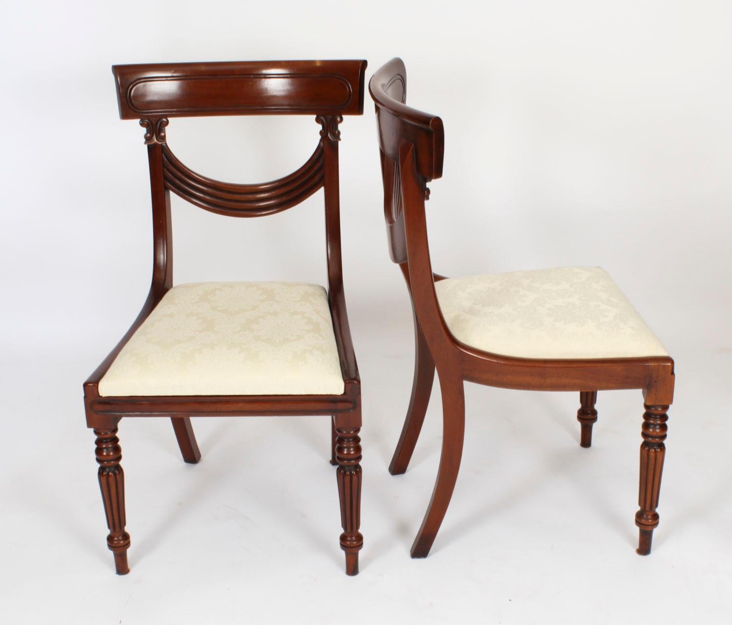 This is a fantastic Vintage English made set of 14 Regency Revival dining chairs, Circa 1980 in date.

These chairs have been masterfully crafted in beautiful solid mahogany. 

The set comprises twelve chairs and two armchairs, all of which feature
