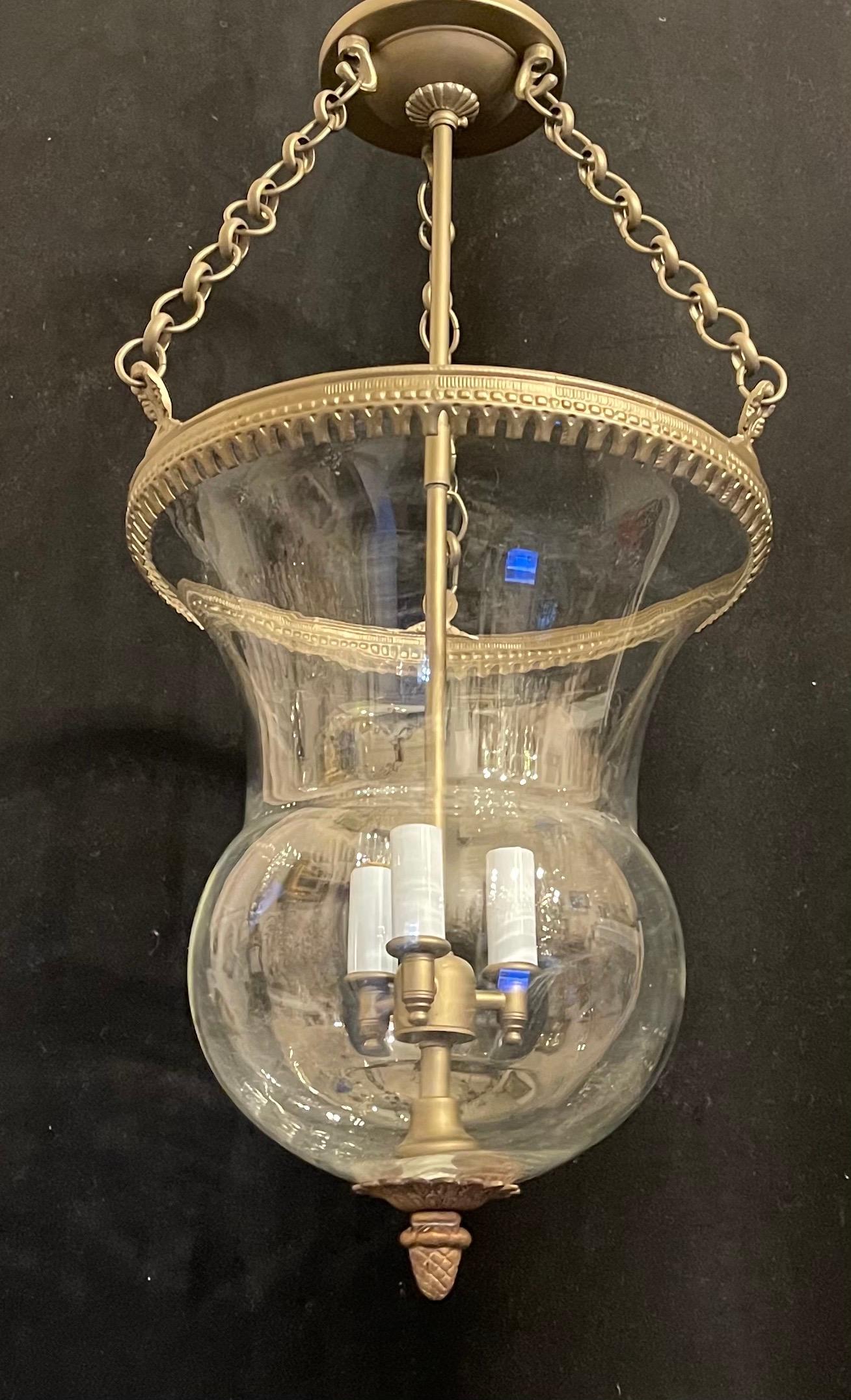 A wonderful vintage set of 3 bell jar gilt bronze and blown glass Vaughn lighting style ceiling flush mount fixtures, these can have chain added to them to accommodate taller ceilings.
Accompanied by canopy and mounting hardware.