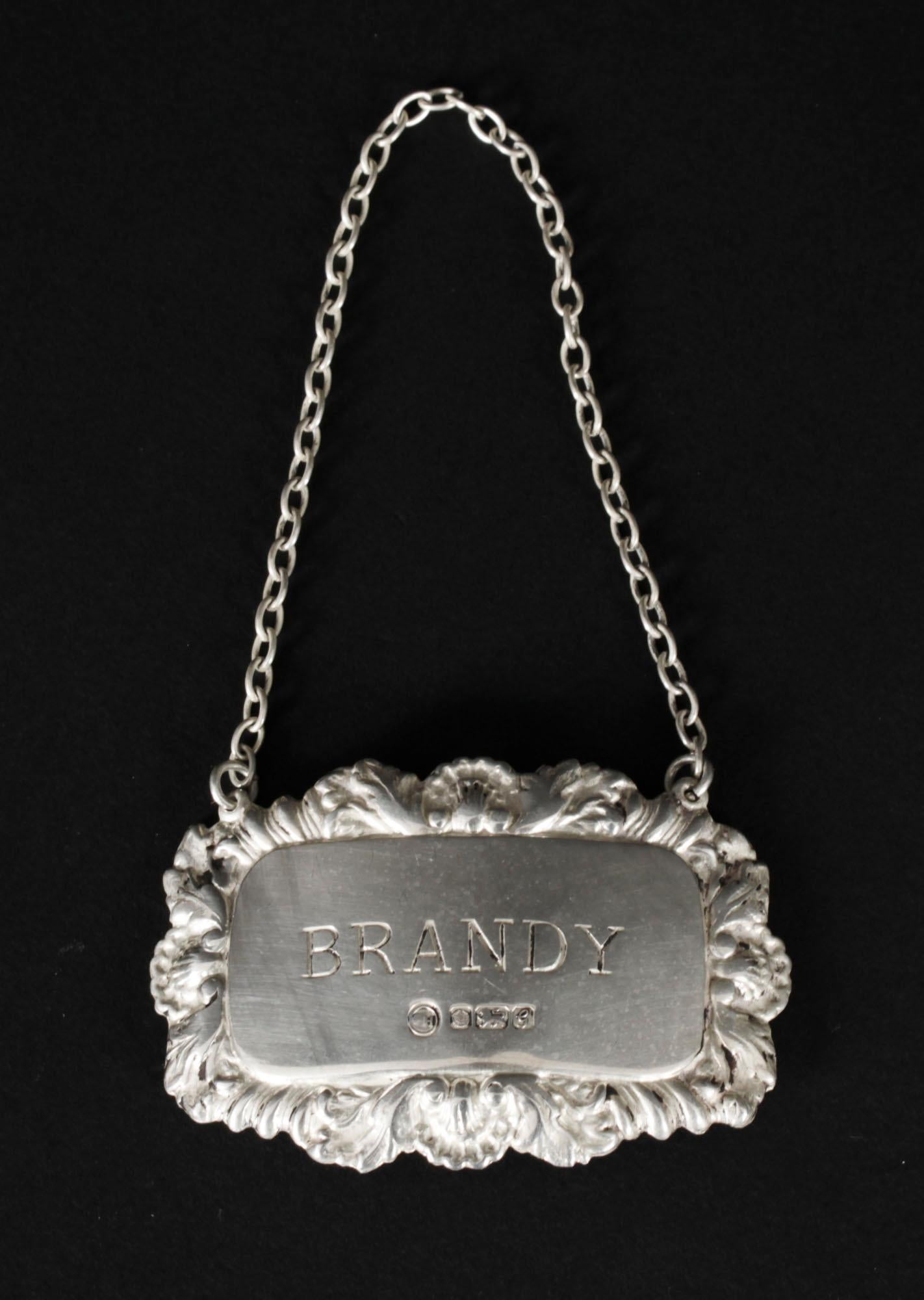 A vintage set of three 925 sterling silver decanter labels with the makers mark for FH Sheffield and the date mark for 1981.

The labels are engraved for 'Brandy', 'Whisky' and 'Sherry', and are of shaped rectangular shaped outline within 
