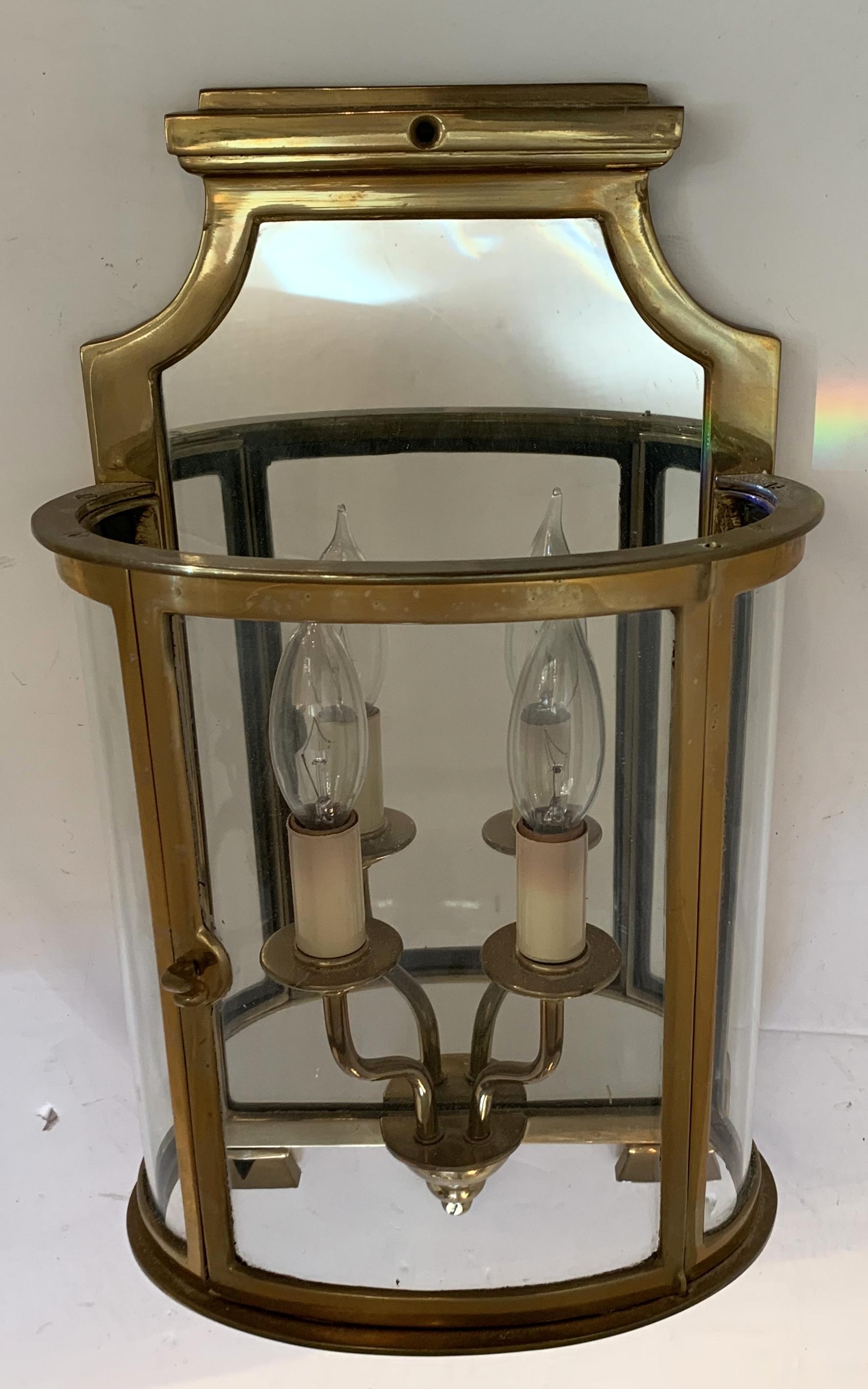 Wonderful pair vintage English style wall lantern from Vaughan, this beautiful design has curved glass door encasing a mirrored back to reflect the light of the two candelabra lights inside and exceptional cast bronze detailing. Rewired and ready to
