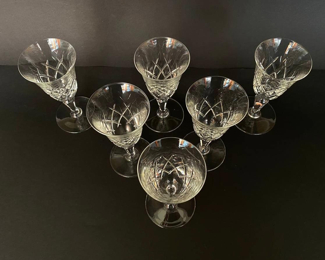Vintage 6 crystal heresy/wine glasses, very elegant with a leg. 

Produced in France, circa 1980s.

Colorless cut 24% Lead Crystal Glasses. Due to it, the glasses acquire a unique melodic silver sound.

Used for serving heresy, wine, water and