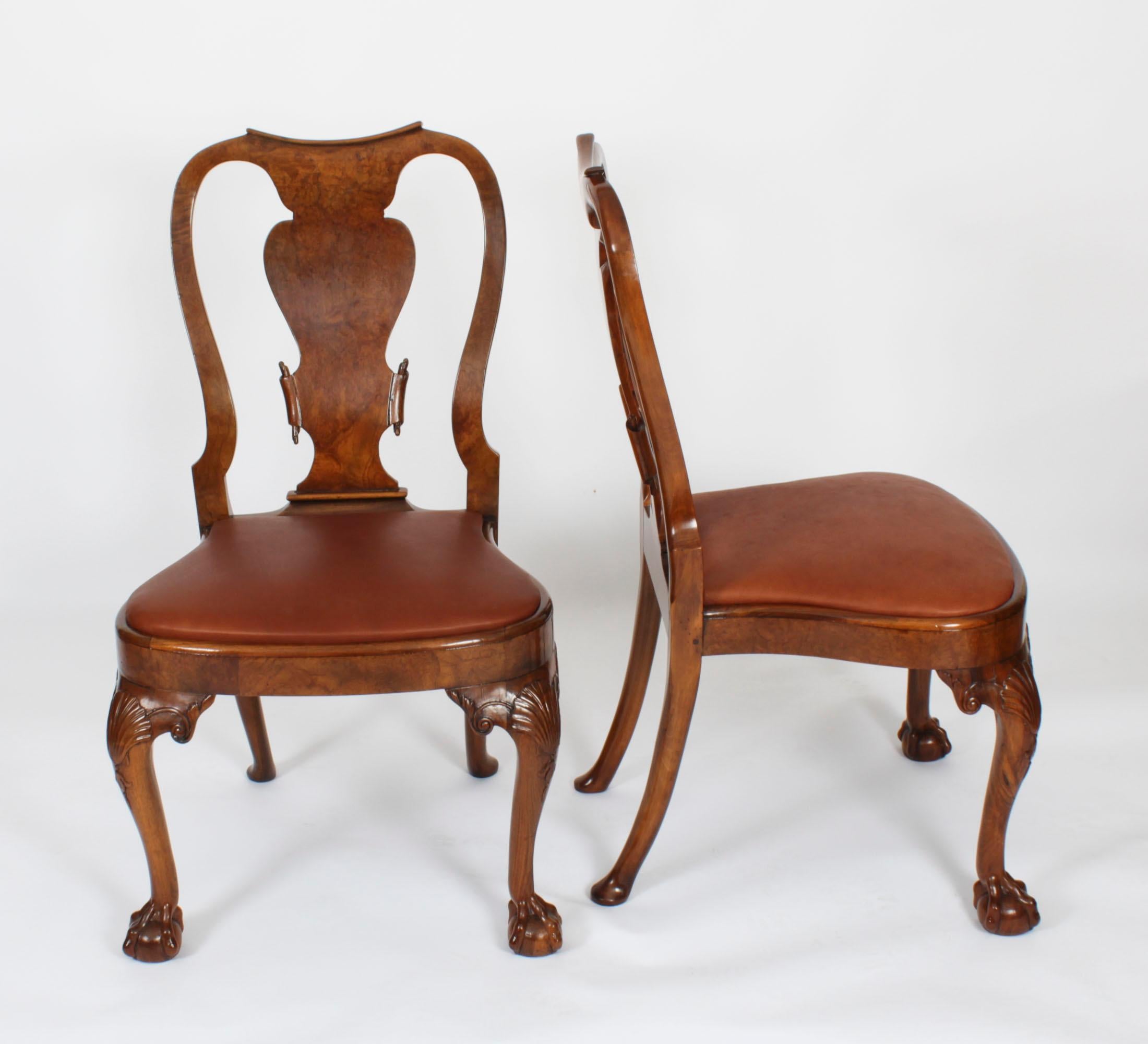 An absolutely fantastic set of eight vintage Queen Anne Revival dining chairs, dating from the mid 20th Century.

The set comprises six side chairs and a pair of armchairs. They have been masterfully crafted in beautiful solid walnut with decorative