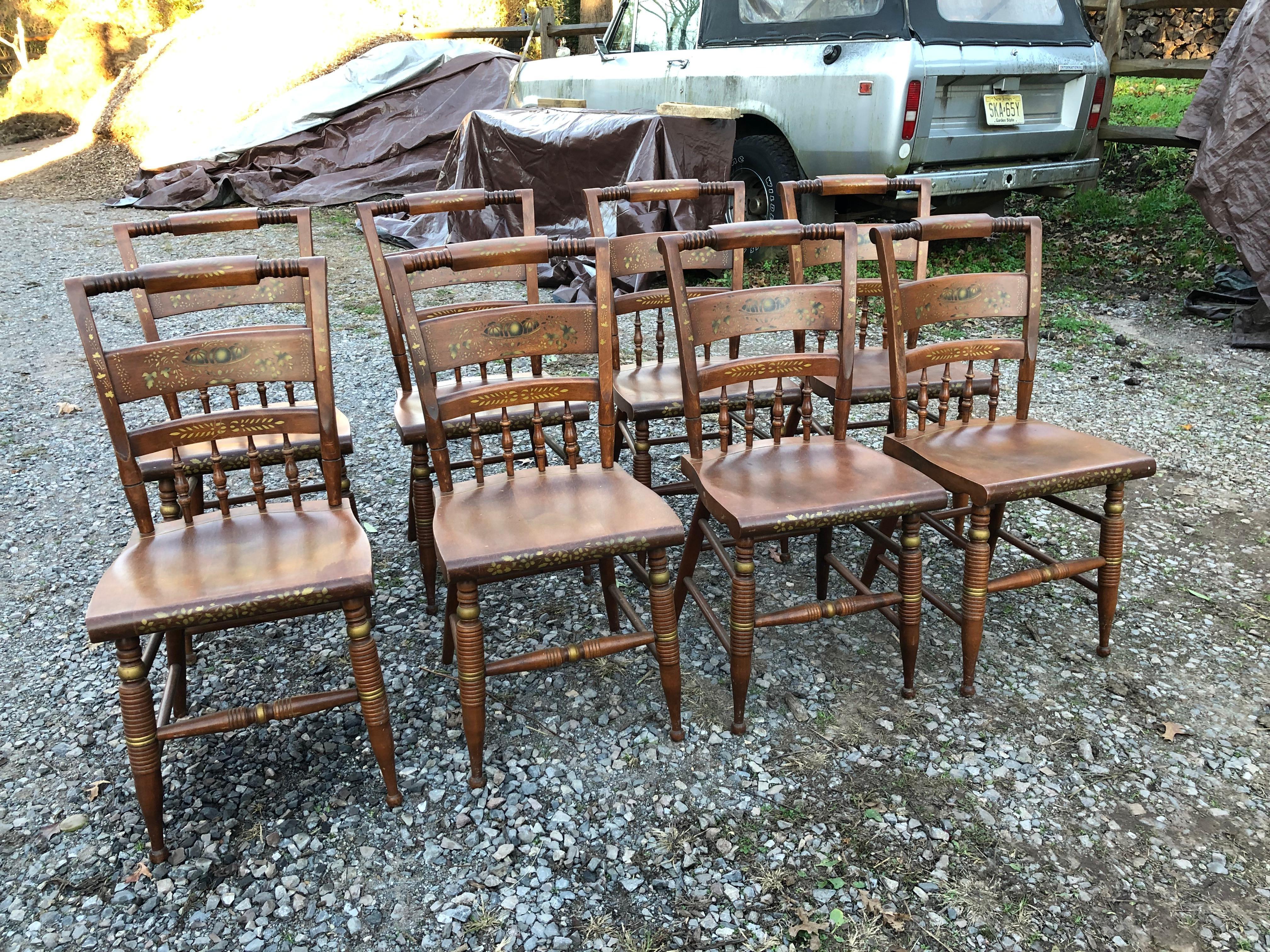A sturdy timeless set of 10 Nichols & Stone Hitchcock style dining chairs including 8 side chairs and two armchairs. The armchairs are 22.25 w 16.25 d 34.25 h
arm height 27 seat height 18.25
Classic gold painted decoration on honey warm wood.