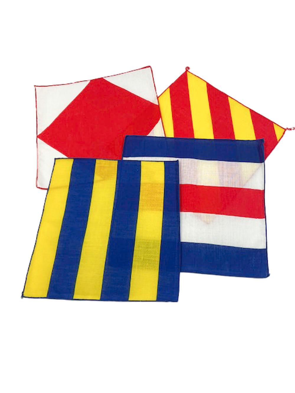 Boxed set of 12 nautical flag linen cocktail napkins by Leacock of New York. Printed on linen in red, white, blue and yellow, an enclosed card identifies the letter, word and meaning each flag represents. The napkins appear to have never been used.