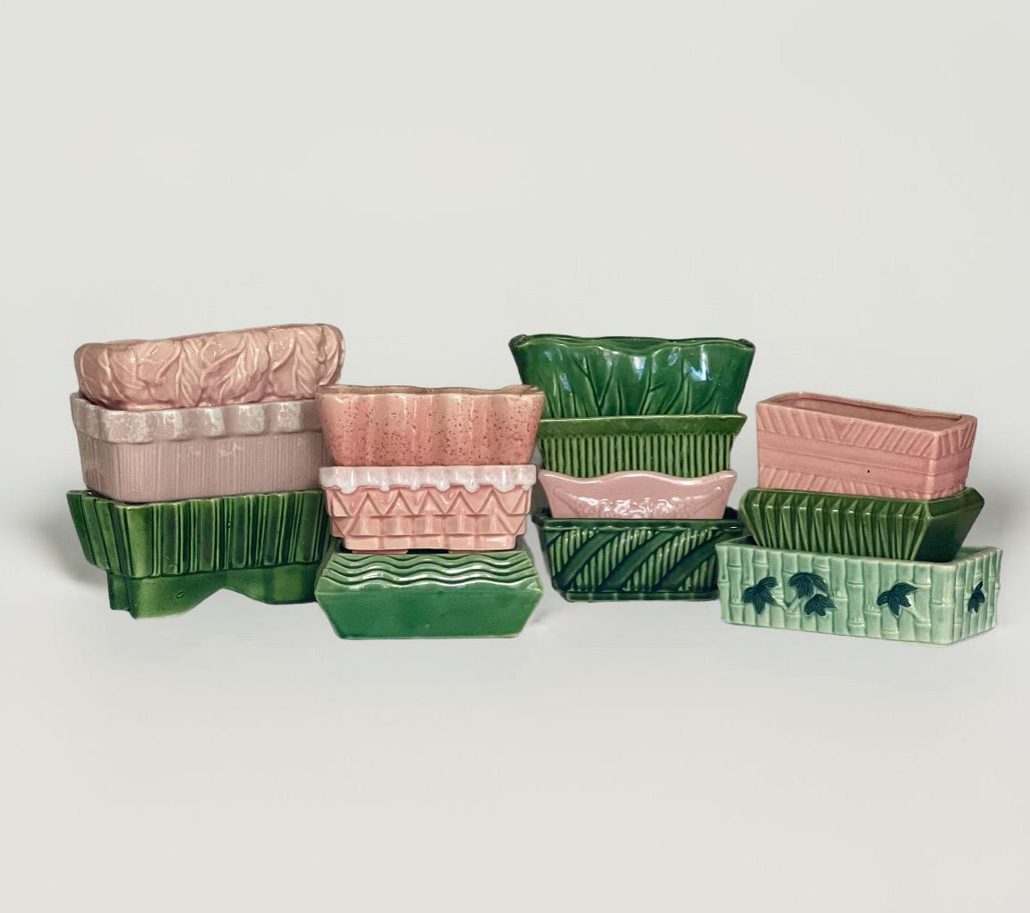 Wonderful vintage collection of thirteen assorted pink and green glazed ceramic petite cache pots by McCoy, Hull Imperial and Ungemach (UPCO) of Roseville, mostly circa 1940s. Many of the pieces are marked. Part of a collection acquired over thirty